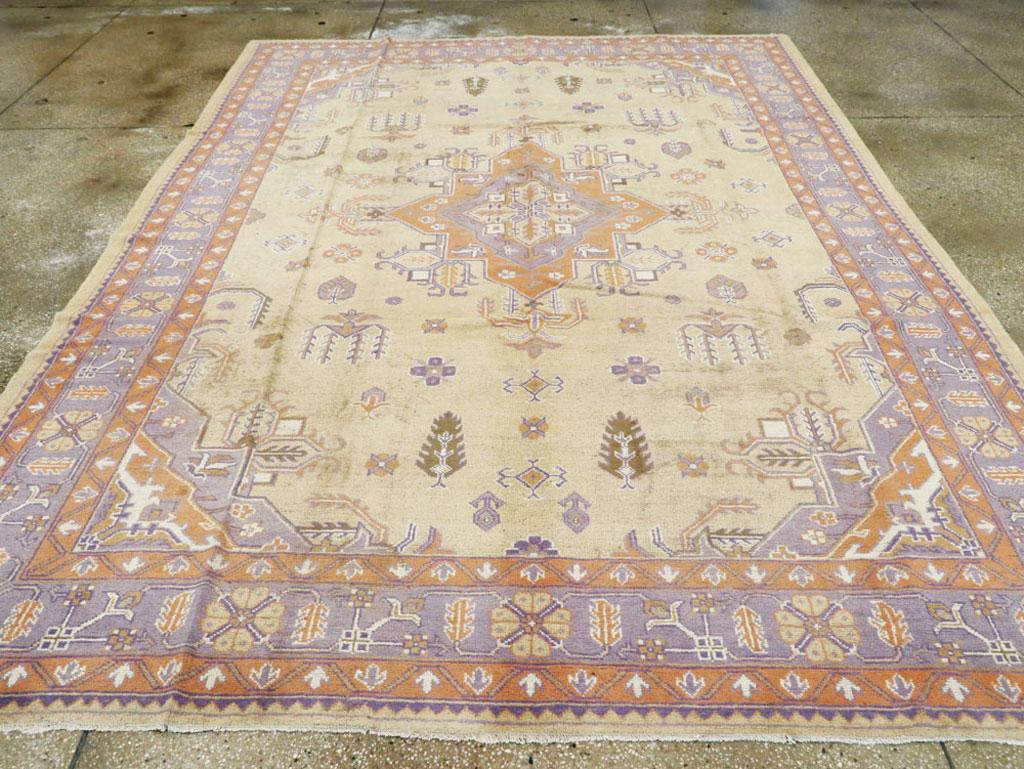 Hand-Knotted Mid-20th Century Soft Colored Oushak Carpet in Beige, Purple, and Orange For Sale