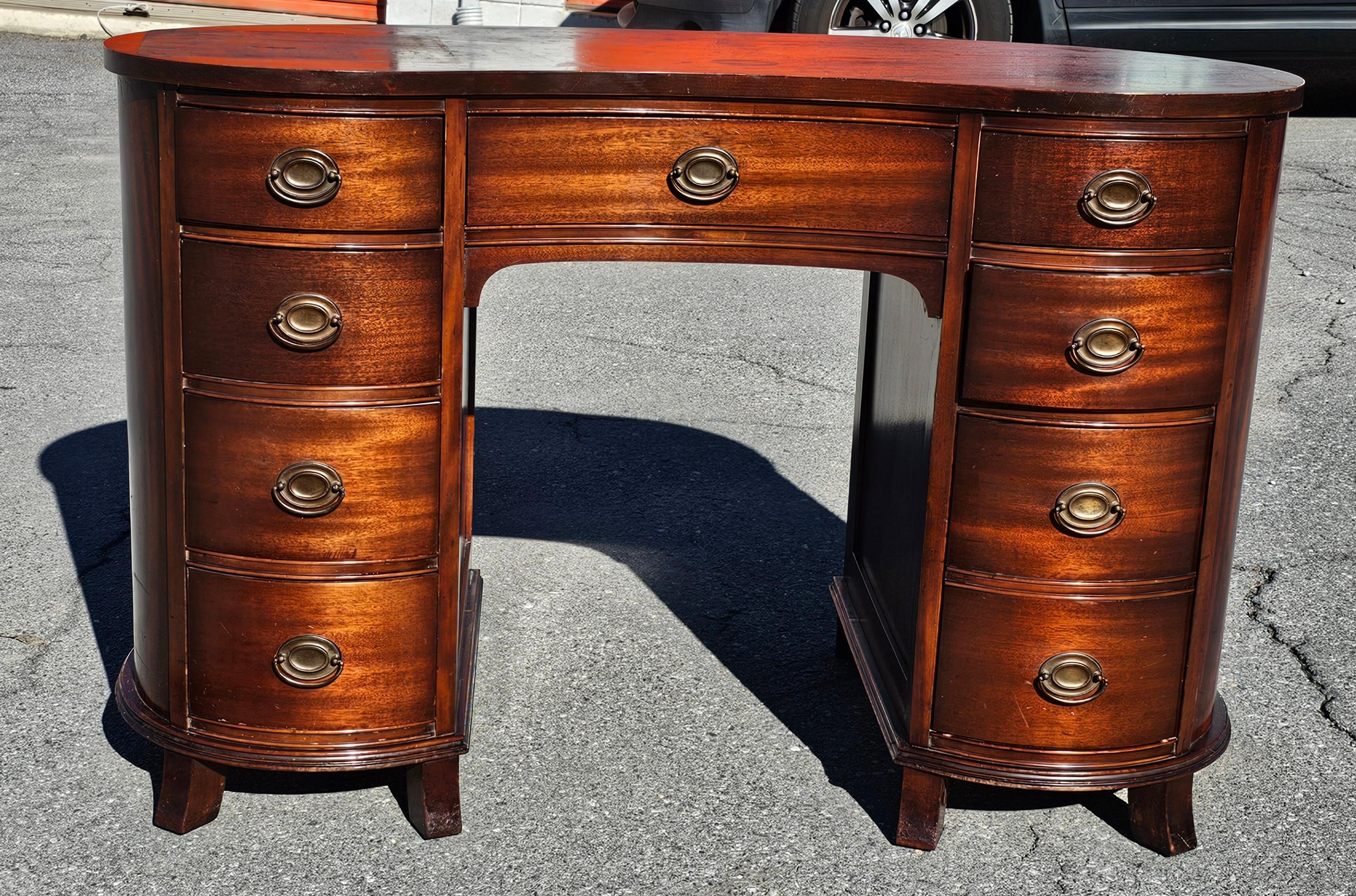 Mid 20th Century Solid Mahogany Federal Kidney Desk in great vintage condition. Top newly and professionally refinished and flawlessly working drawers
Measures 46