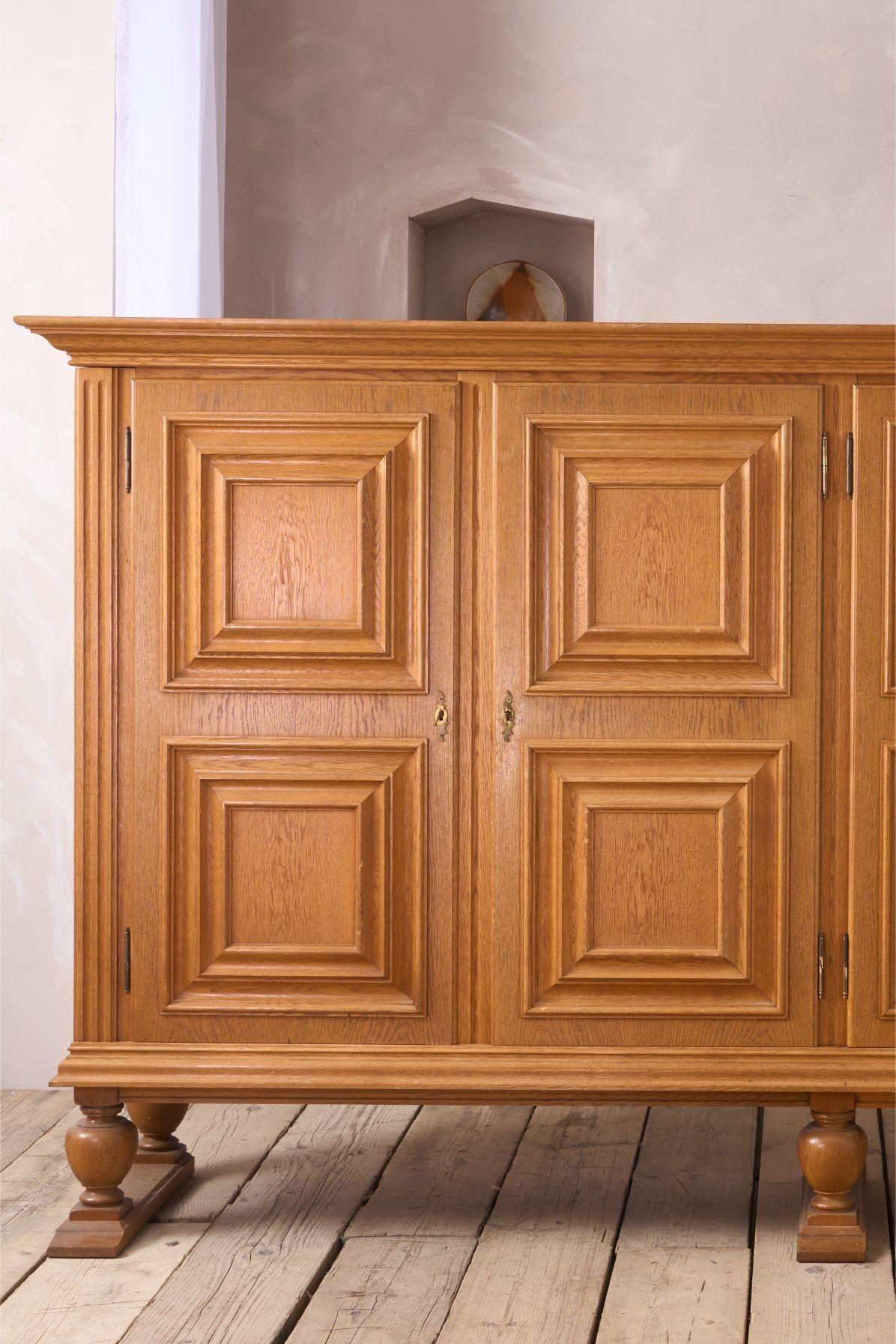 This is a striking mid 20th century Solid oak Brutalist sideboard. Well made and complete with adjustable shelves. (Image shows one side empty but the shelves are on their way!).
The condition overall is very clean with minor age related marks