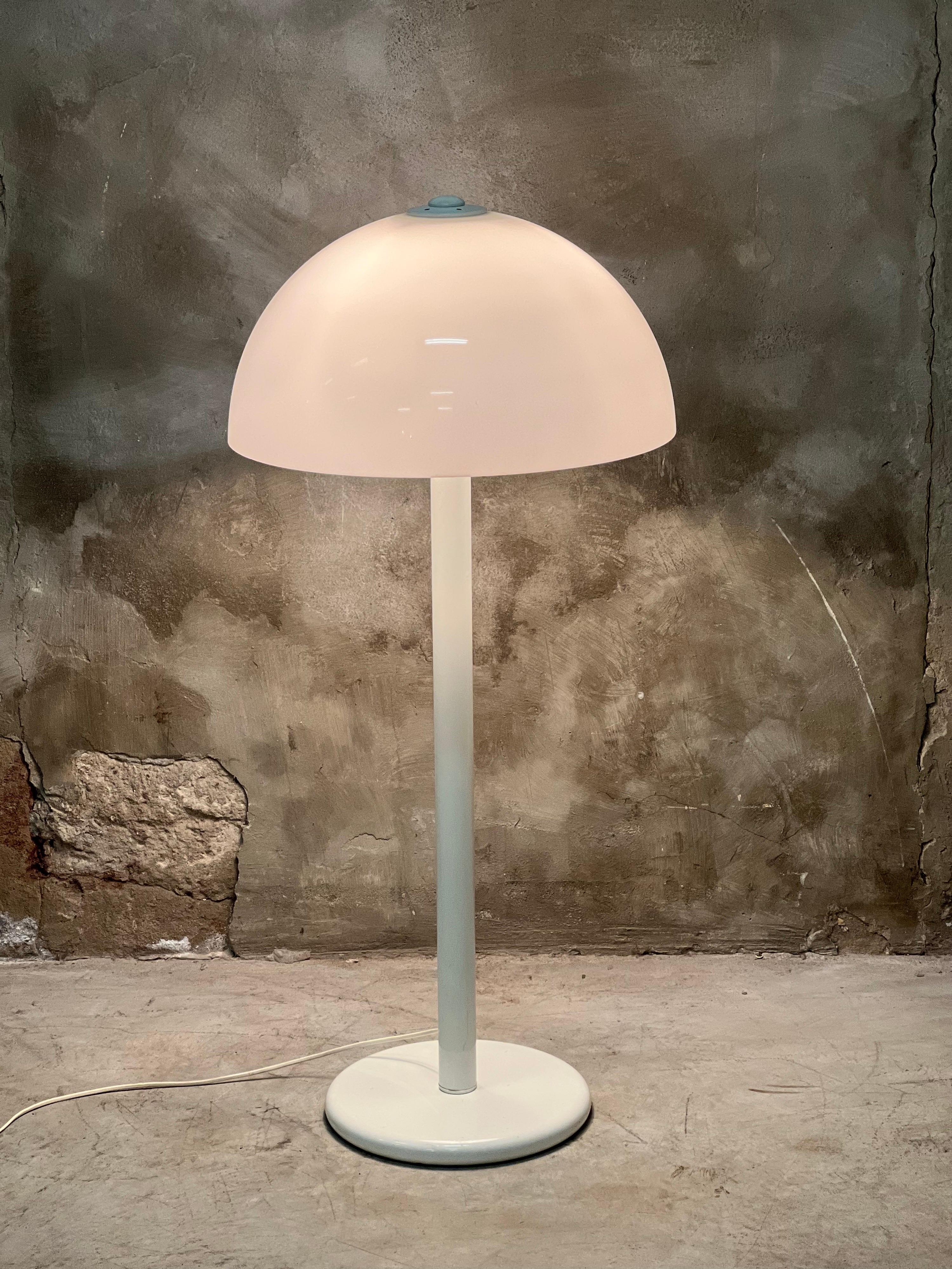 This 1970s mushroom lamp wouldn't look out of place on a large sideboard with a height of 107 cm and a diameter of 50 cm. Intended as a floor lamp with foot switch. Metal base and clear white plastic shade. All are in neat condition with minimal