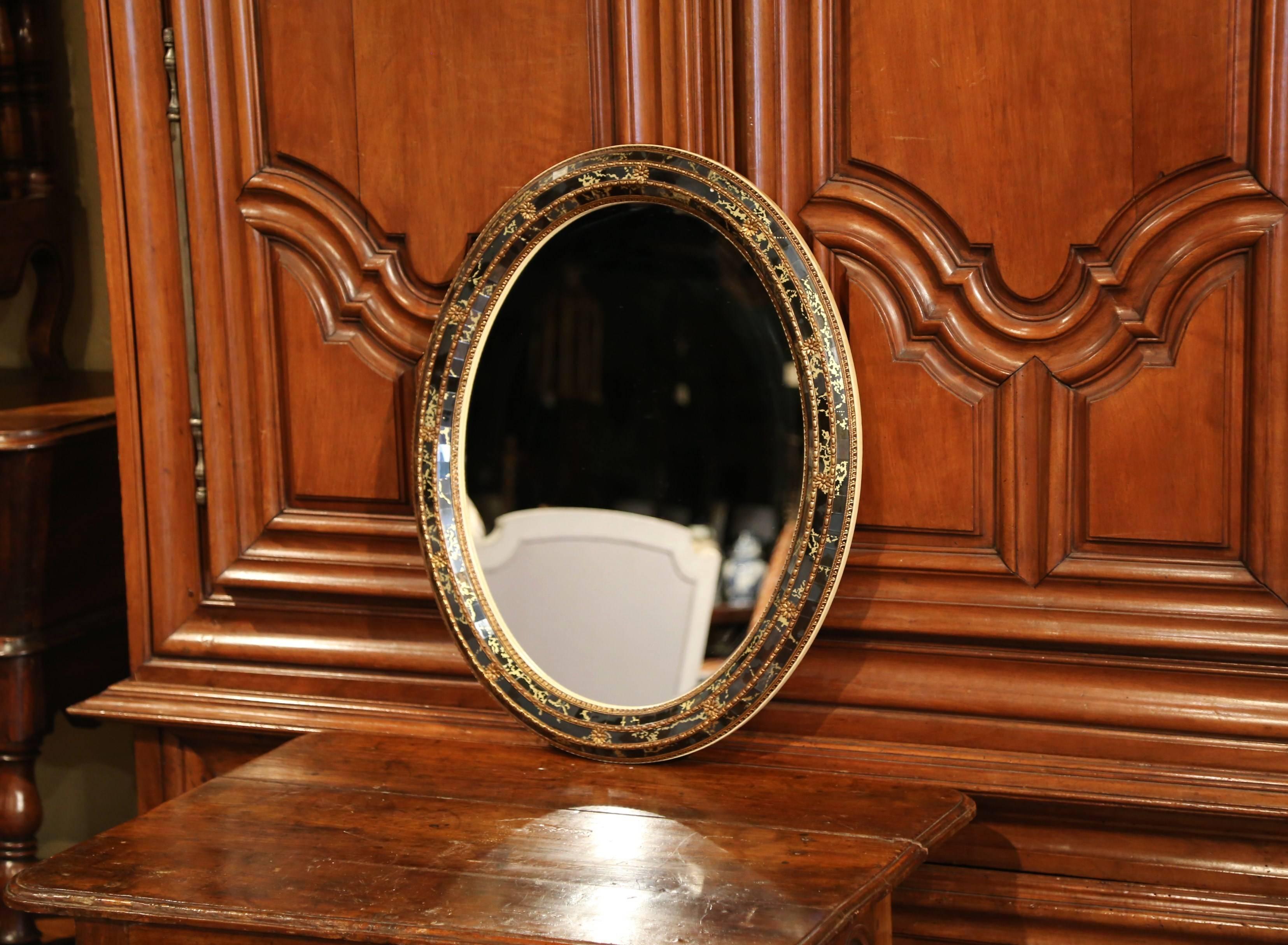 This antique wall mirror was created in Spain, circa 1950; it has a 