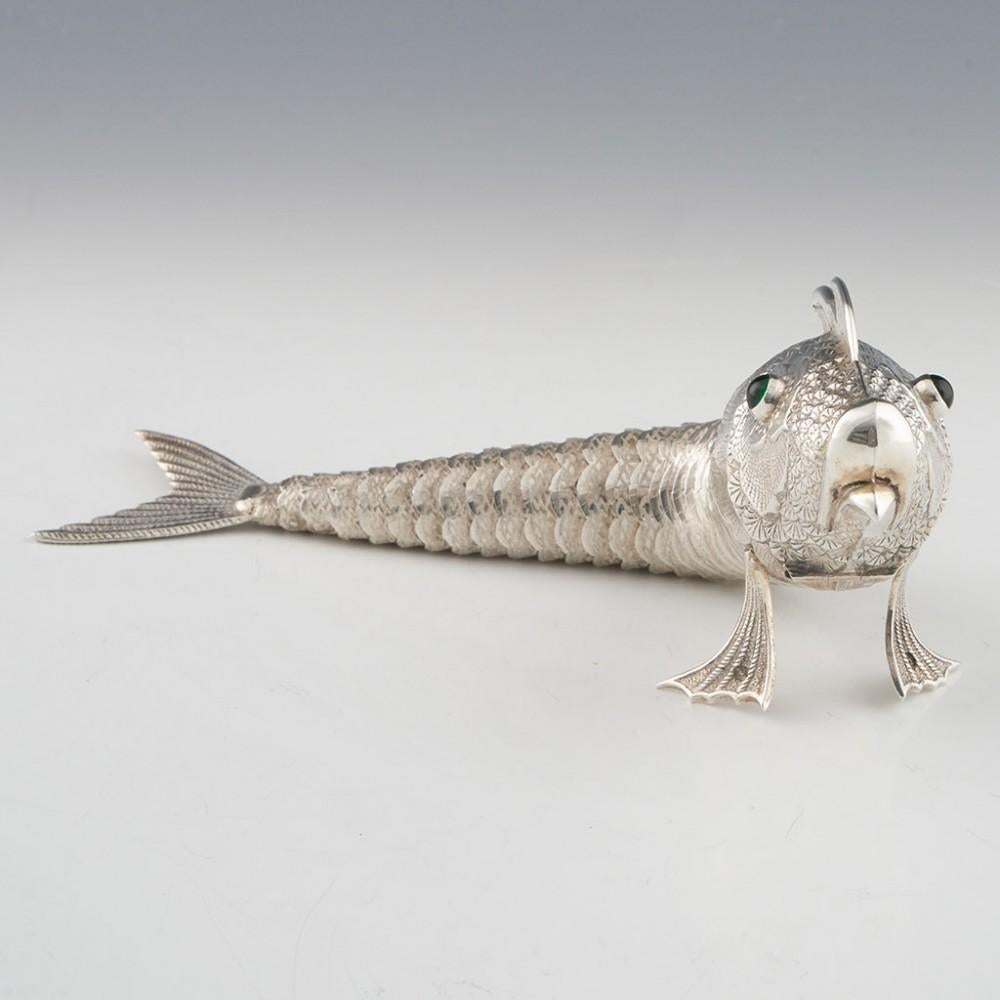 Heading : Mid 20th century Spanish silver articulated fish sculpture
Date : Mid 20th century
Period : Franco
Origin : Madrid, Spain
Decoration : In the form of a fish, the articulated scales allowing for flexibility in the body of the fish. The fish
