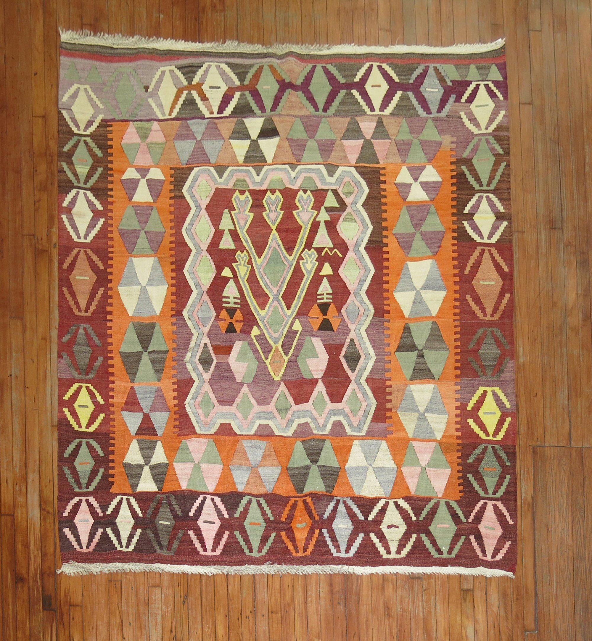 Mid-20th Century Turkish square size Kilim.

Measures: 6'8” x 7'

With the Jijim weaving technique, different colored threads are applied between the weft and warp threads, on the reverse of the weave. It is often used to decorate a plain-weave