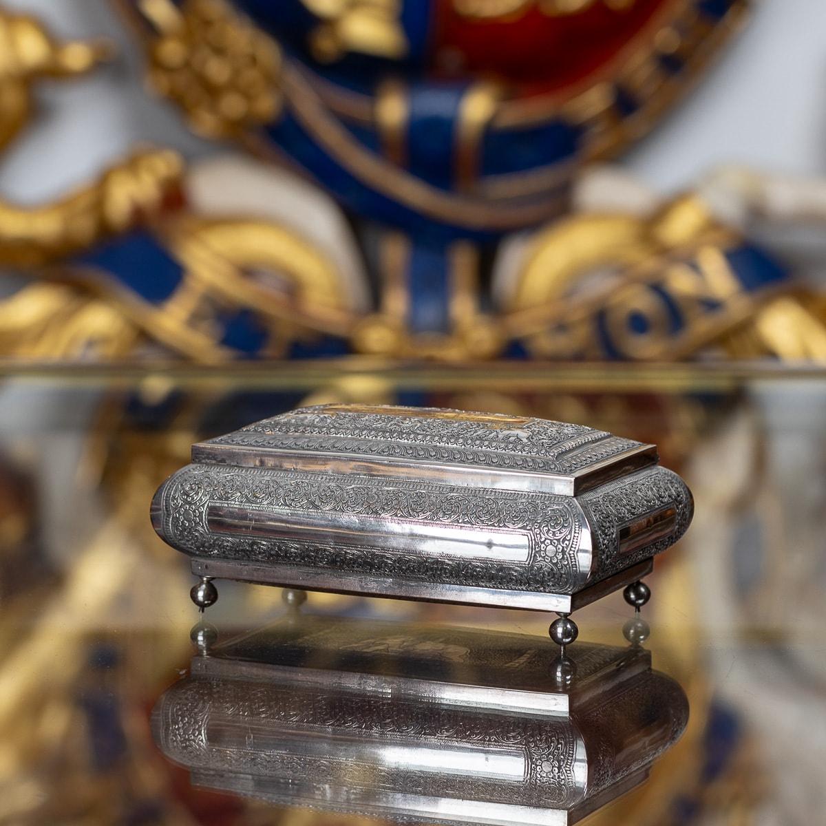 Mid 20th Century Sri Lankan solid silver box, of rectangular form, beautifully engraved and chased with a repousse design and featuring elephants amongst foliage. The lid has an engraved plaque ' To W D MacBey Esor, presented by The Staff of the