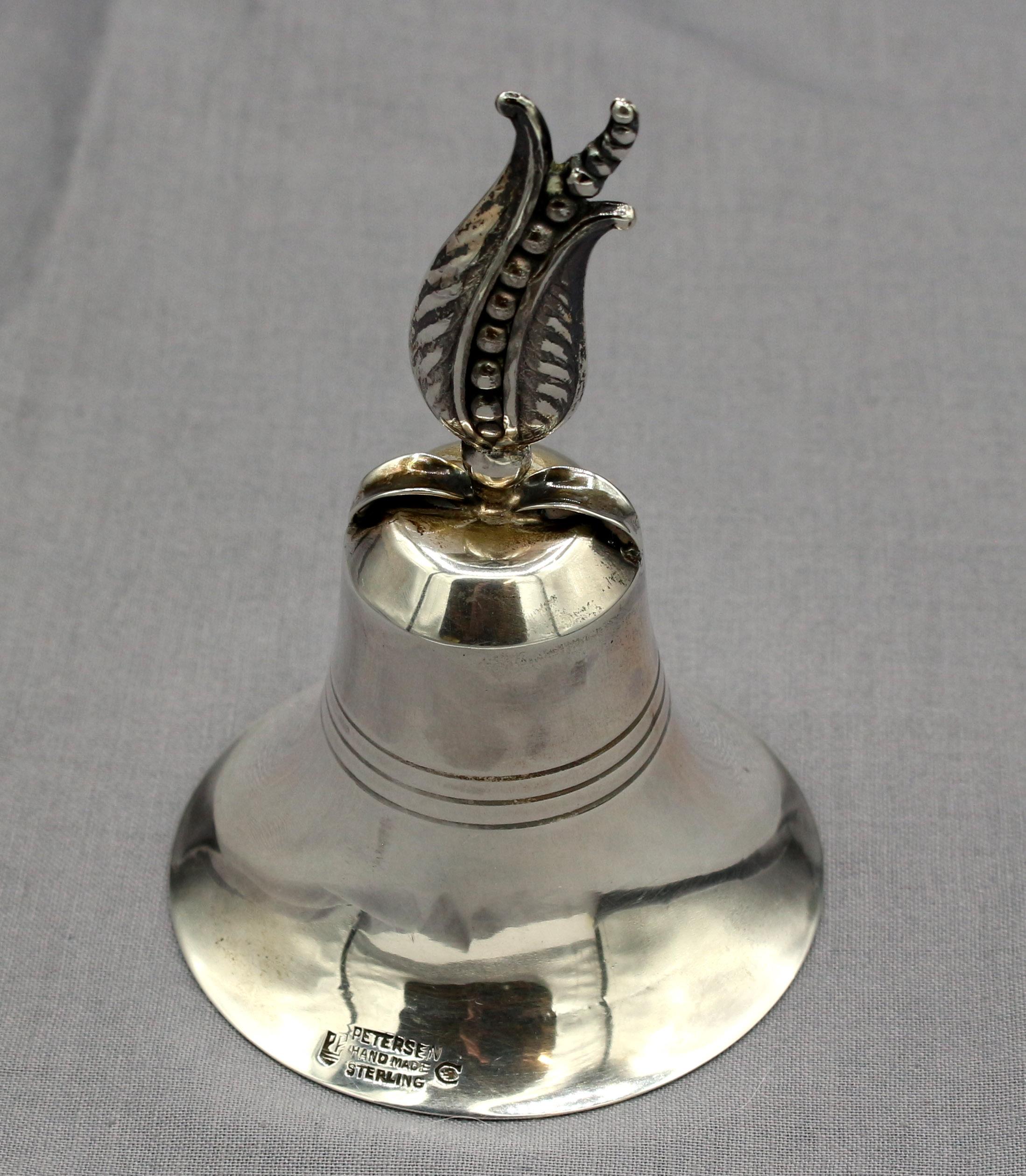 Circa 1950-70 sterling silver dinner bell by Carl Poul Petersen, Montreal, Canada. Mid century modern. Petersen apprenticed under Georg Jensen & married his daughter Ingrid. Fully marked. Hand made. Peapod handle. 1.50 troy oz. Estate of Linda