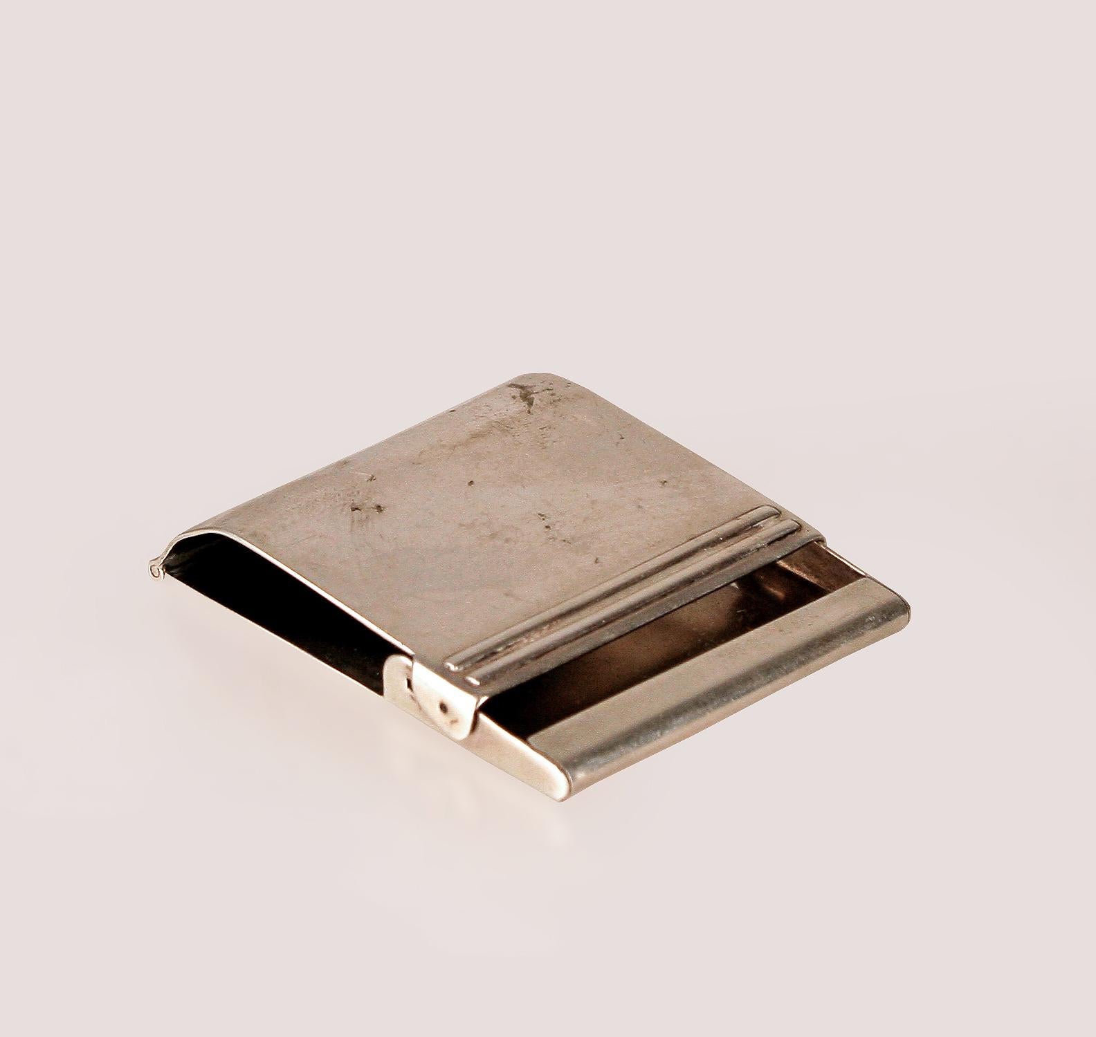 Mid-20th century american cased sterling silver flip matchbook cover/match holder by Tiffany & Co.

By: Tiffany & Co.
Material: metal, silver, silver plate, sterling silver
Technique: metalwork, plated, polished, silvered
Dimensions: 2 in x 2 in x