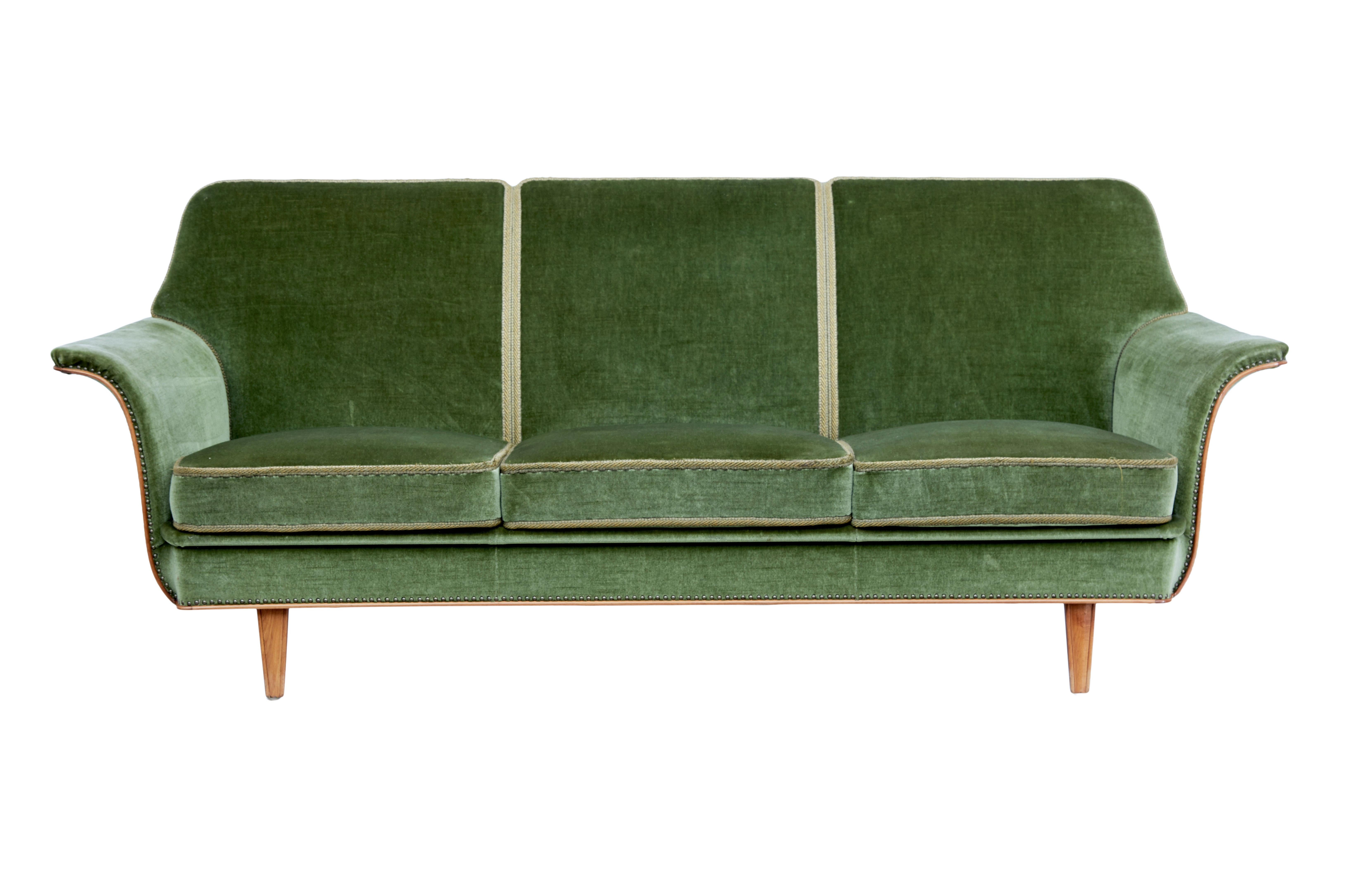 Mid 20th century Swedish 3 piece suite from late 1960's.

Suite comprises of a sofa with 2 matching armchairs which is upholstered in a striking green velour fabric with contrasting braiding.

Sofa seats a comfortable 3, with 3 removable seat