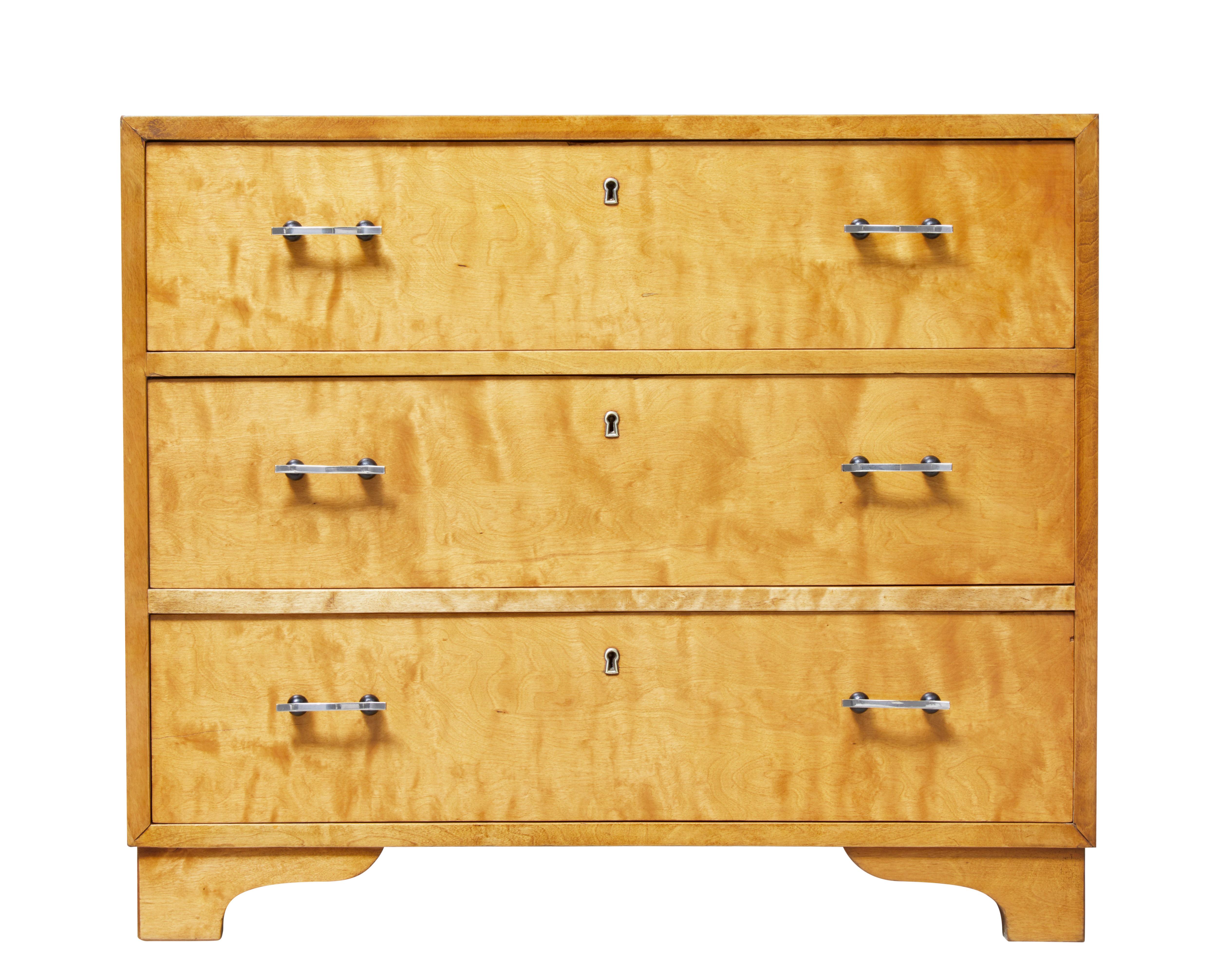 Good quality Swedish chest of drawers, circa 1940.

Three drawers of equal proportion fitted with shaped steel handles. Rich golden color.

Recently restored with minor restorations to veneer, minor surface marks.