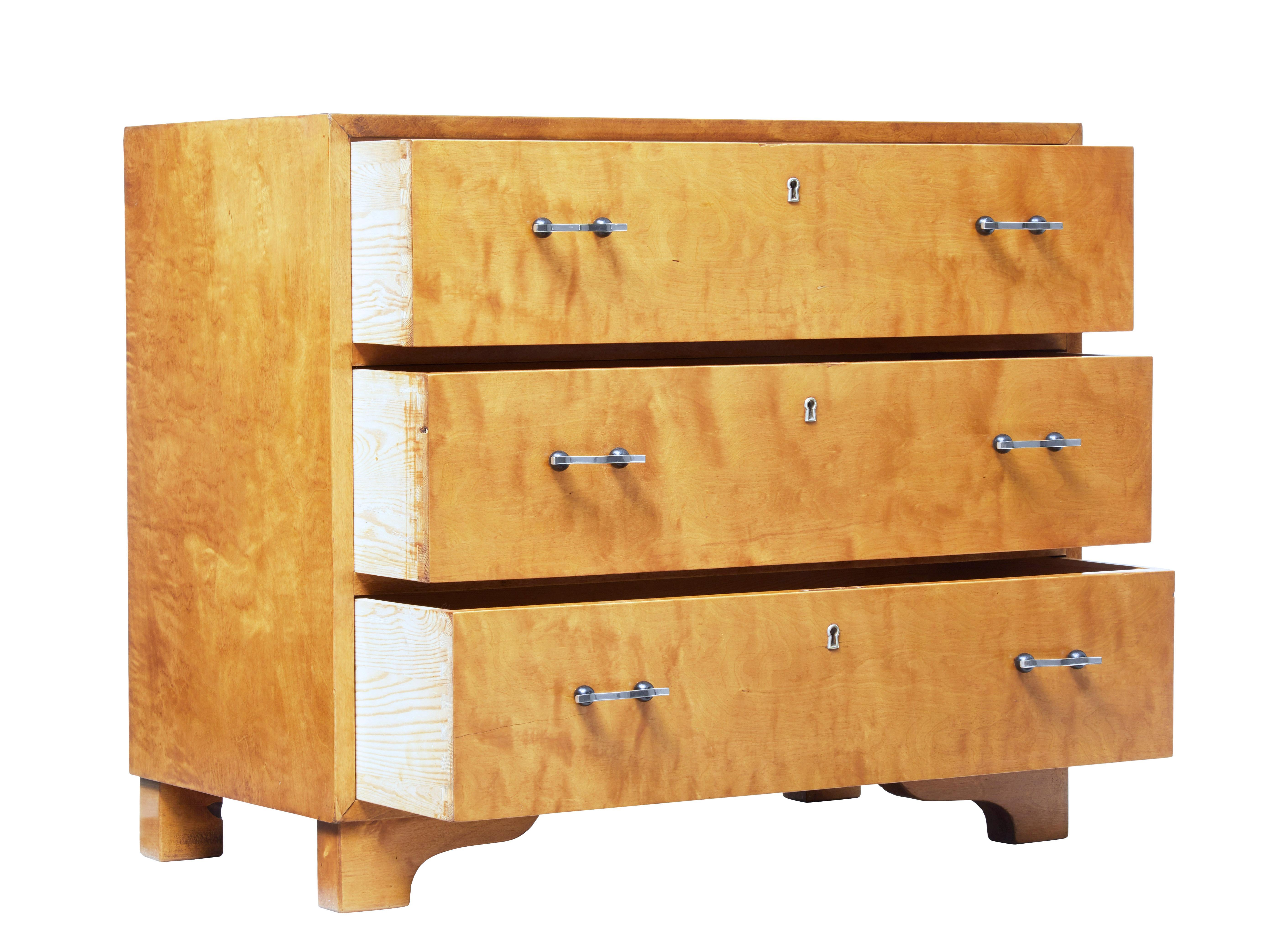 Good quality Swedish chest of drawers circa 1950.

3 drawers of equal proportion fitted with shaped steel handles and key plates. Rich golden colour.

Standing on bracket feet.

Recently restored with minor restorations to veneer, minor