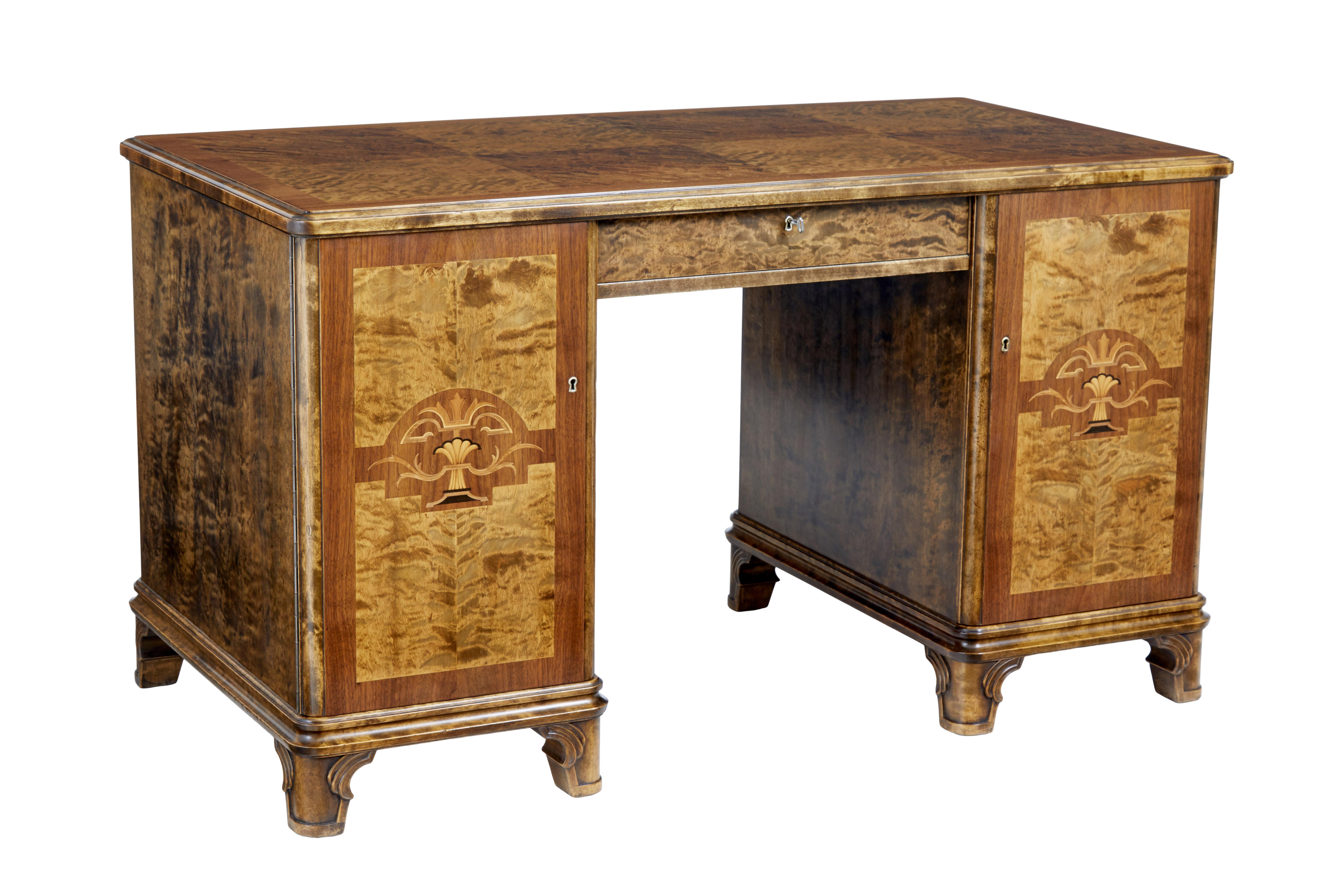 Mid 20th century Swedish birch inlaid pedestal desk, circa 1940.

Fine quality 1 piece art deco inspired Swedish made desk. Writing surface with arranged burr birch matched veneers surrounded by a walnut border. Single drawer above the knee with