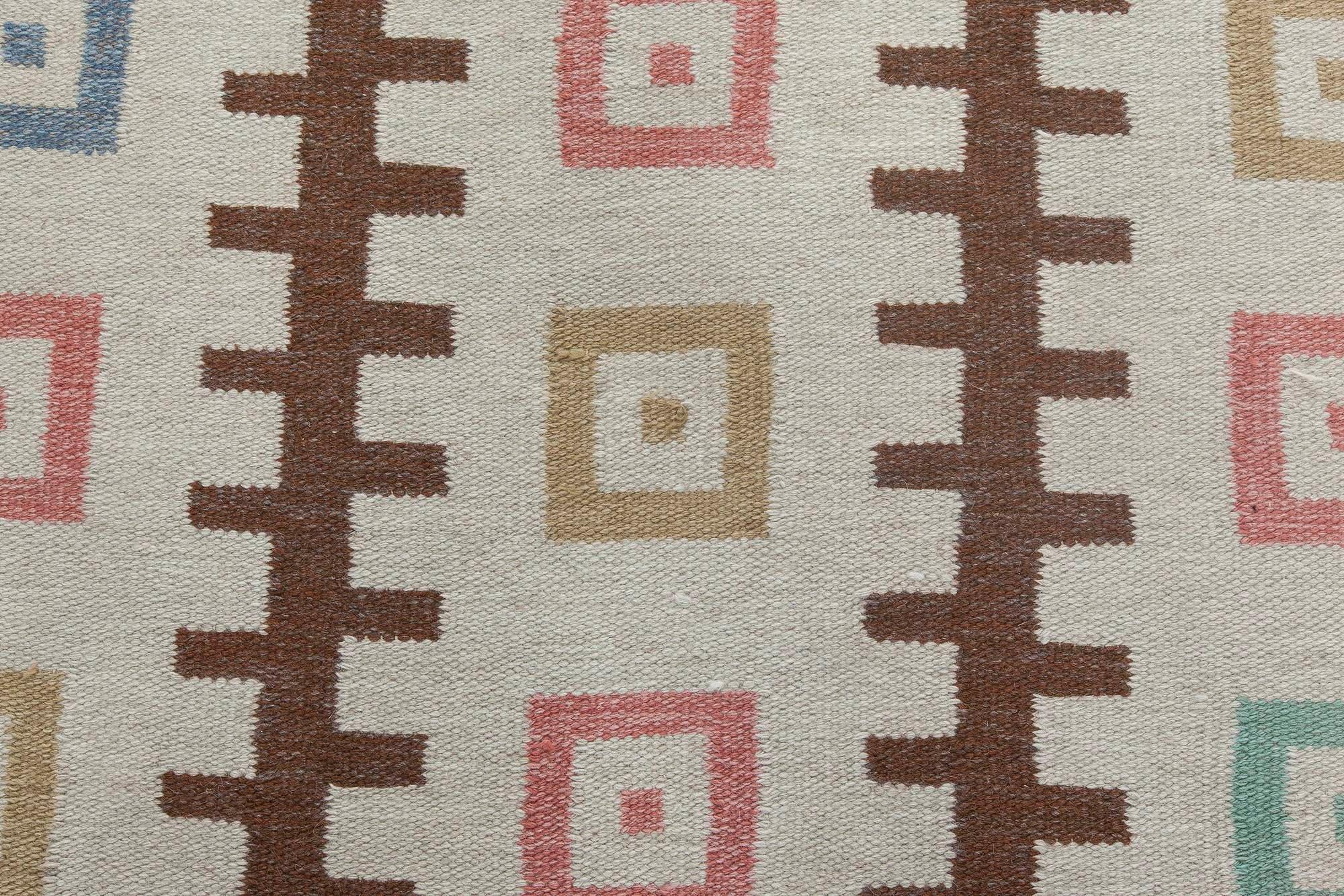 Mid-20th century Swedish geometric design handmade wool rug. Woven initials and date 'GO 1952'
Size: 6'3
