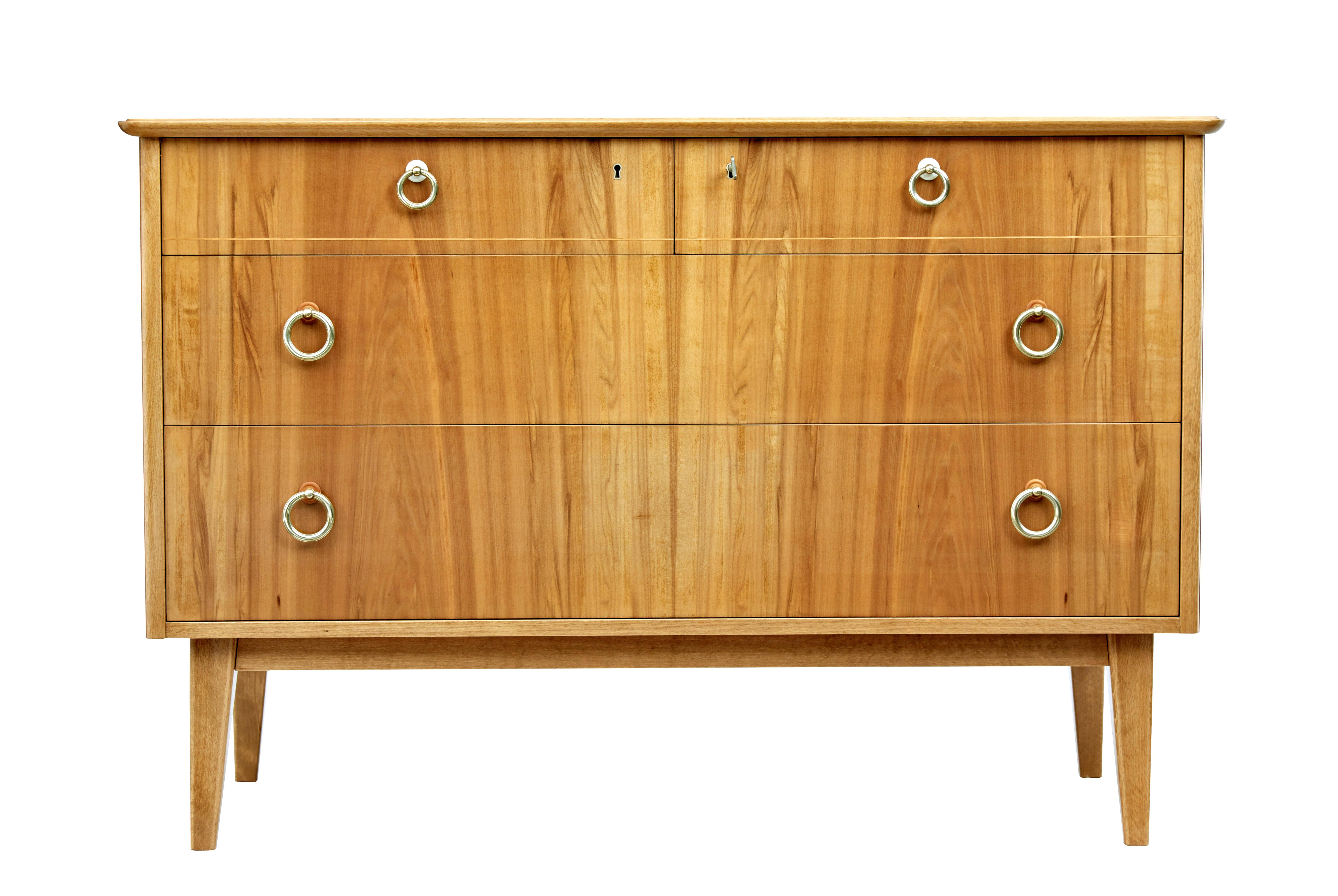 Mid 20th century swedish walnut chest of drawers by bodafors circa 1950.

Good quality chest of drawers finished in light walnut.  Fitted with 4 graduating drawers in a 2 over 2 layout, complete with original brass ring handles.  Stringing detail to