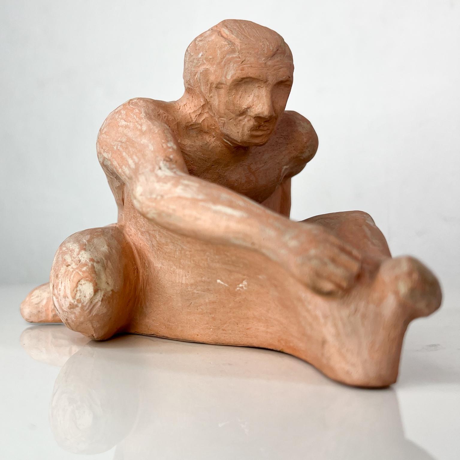 Mid-20th century terracotta art sculpture naked man athlete L Cook.
Signed at bottom L Cook.
Measures: 6.75 deep x 4.25 wide x 4.38 tall.
Preowned original vintage condition.
Refer to images provided.
 