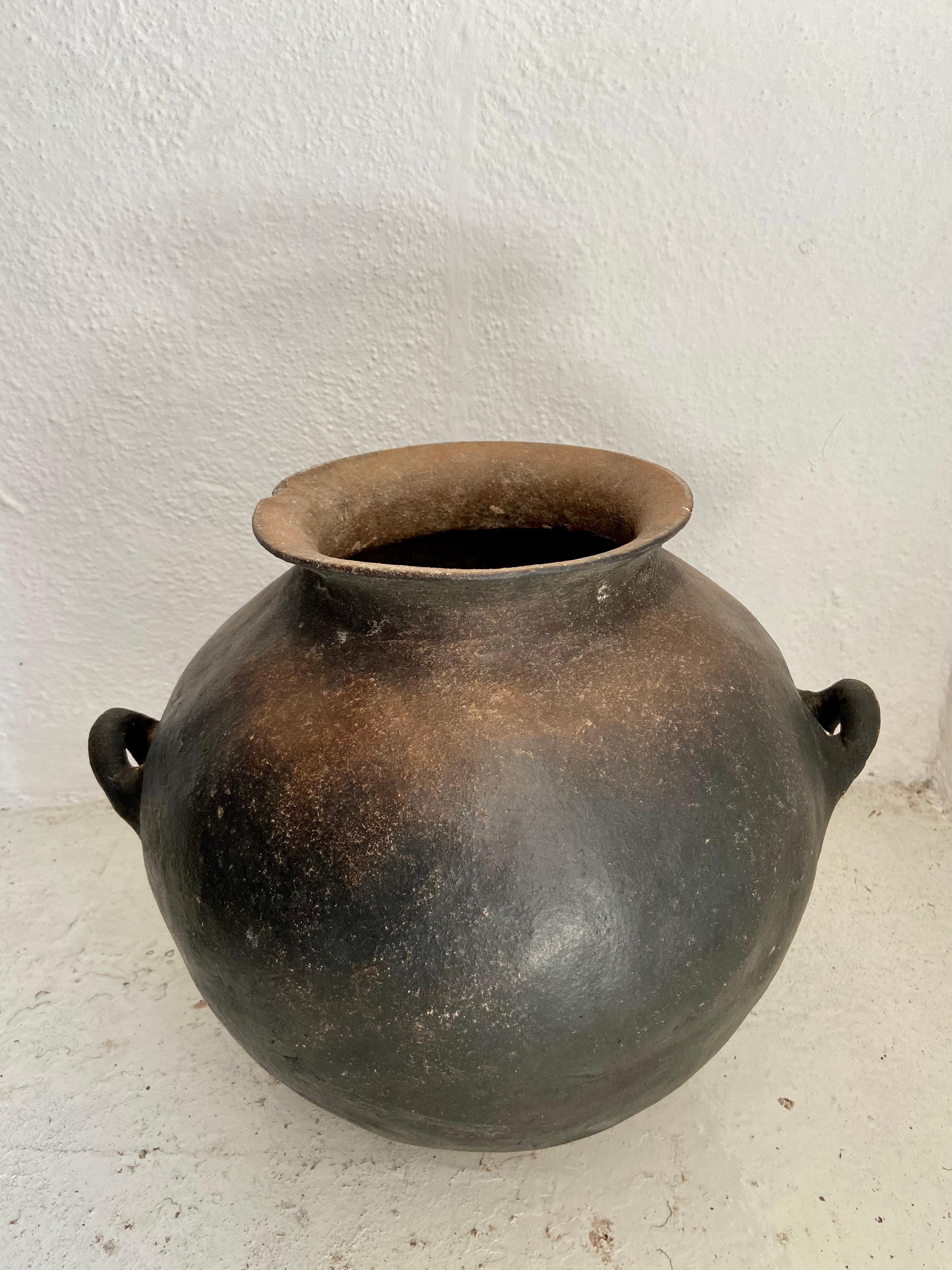 Mid 20th century terracotta water pot from Central Mexico. Used for cooking, this form of pottery is unique to the Nahuatl speaking indigenous communities of the northern, remote communities of Puebla.