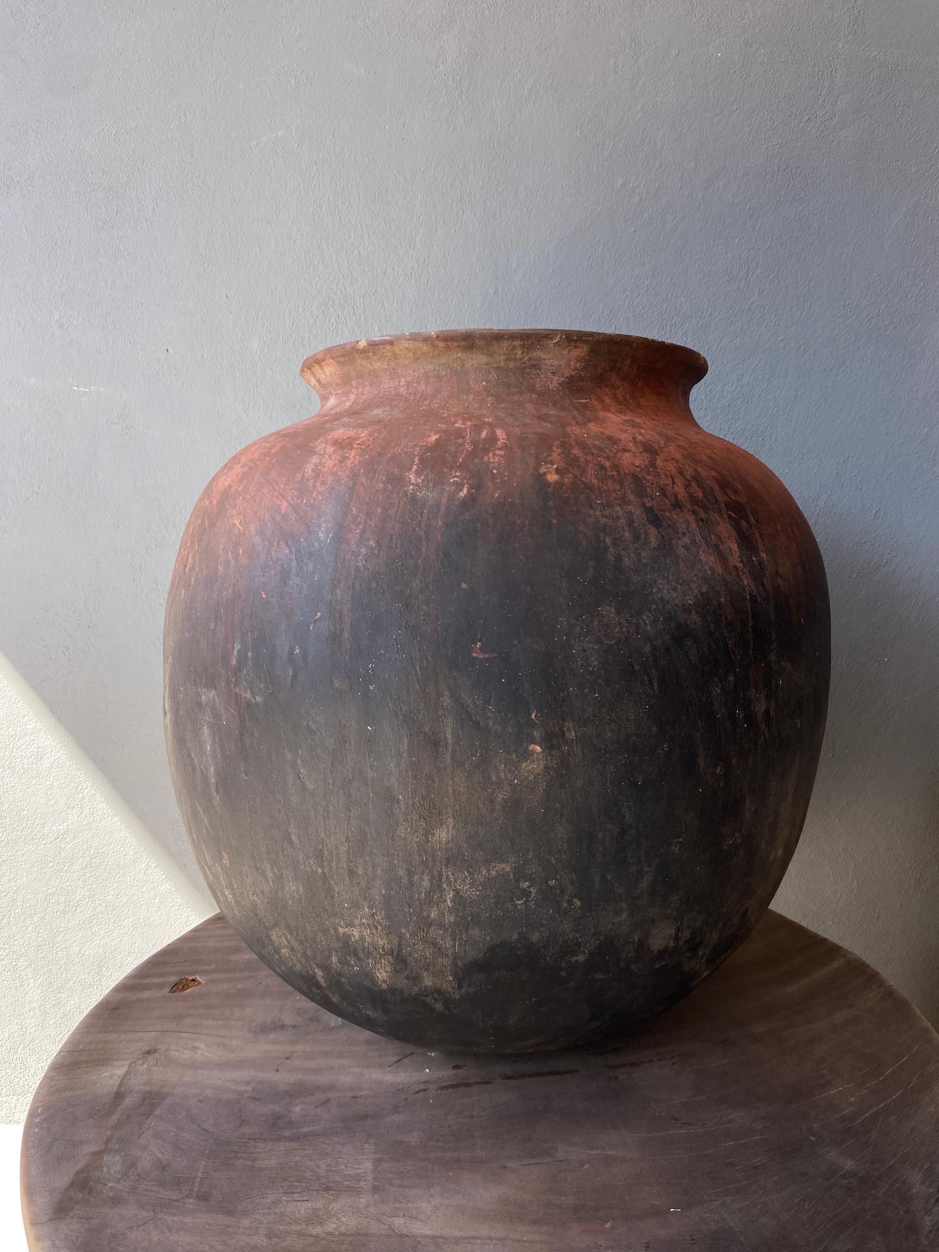 Mid 20th century terracotta water pot from the high sierras of Michoacan, Mexico.  Nicely formed consistent shape throughout. Hand coiled pottery.
