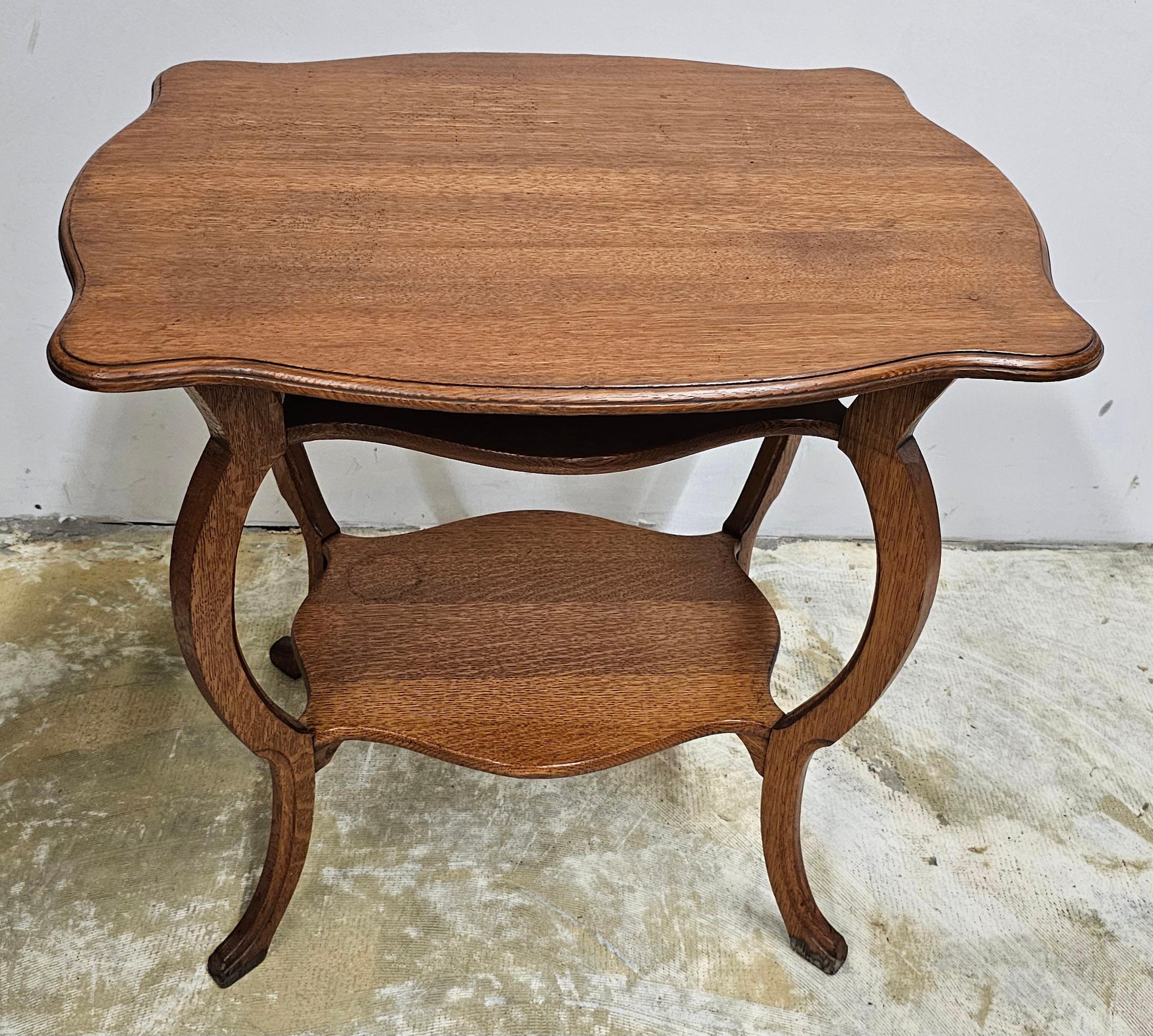 A Mid 20th Century Three Tier Victorian Style Oak accent  Side Table. Measures 28
