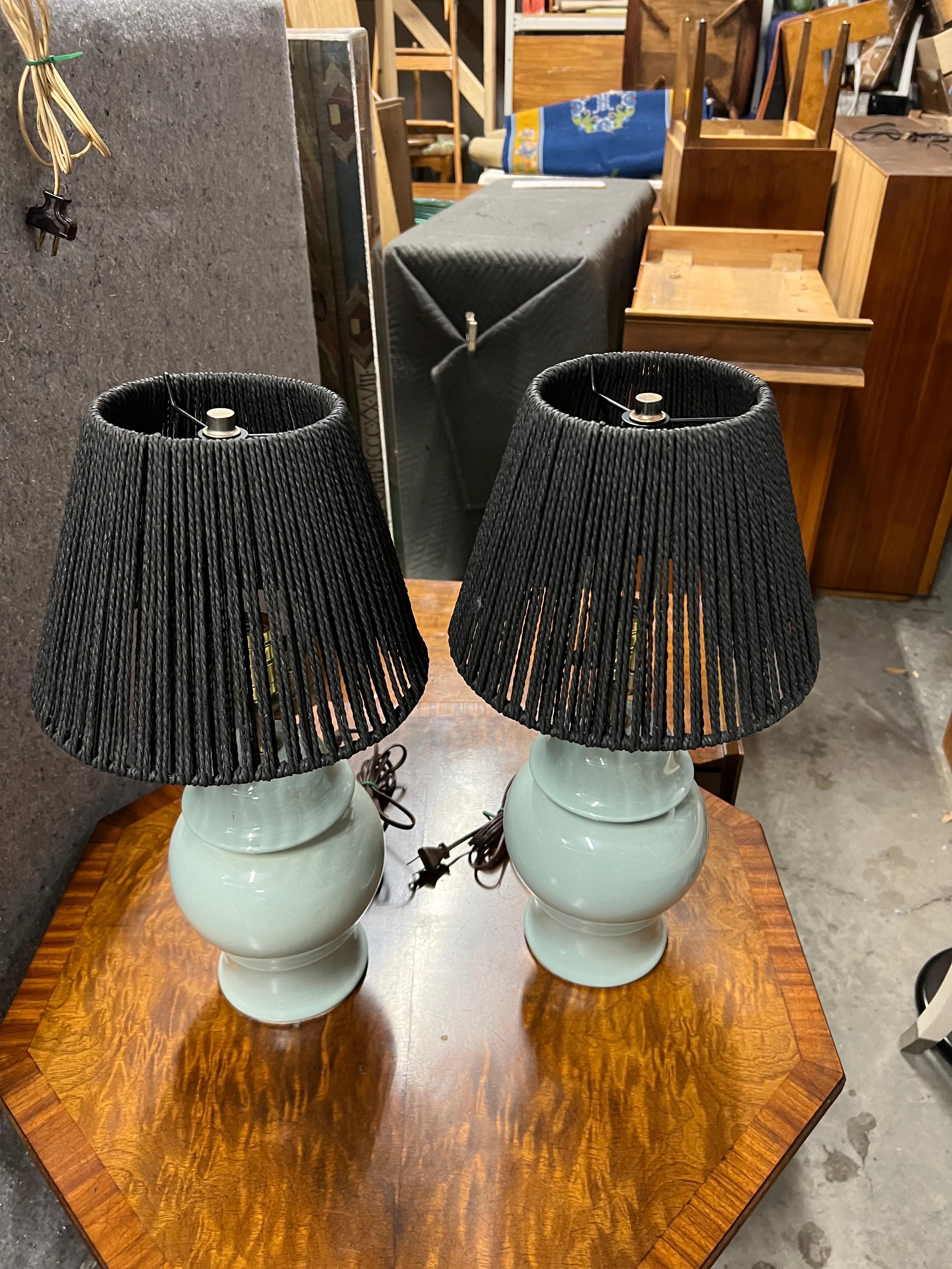 Mid-20th Century Tiffany Blue Table Lamps With Woven Shades - a Pair. Everything is original with no chips or cracks.  Great color!  New shades. 

Shades with harp and finial measure: 7.6” x 10” diameter