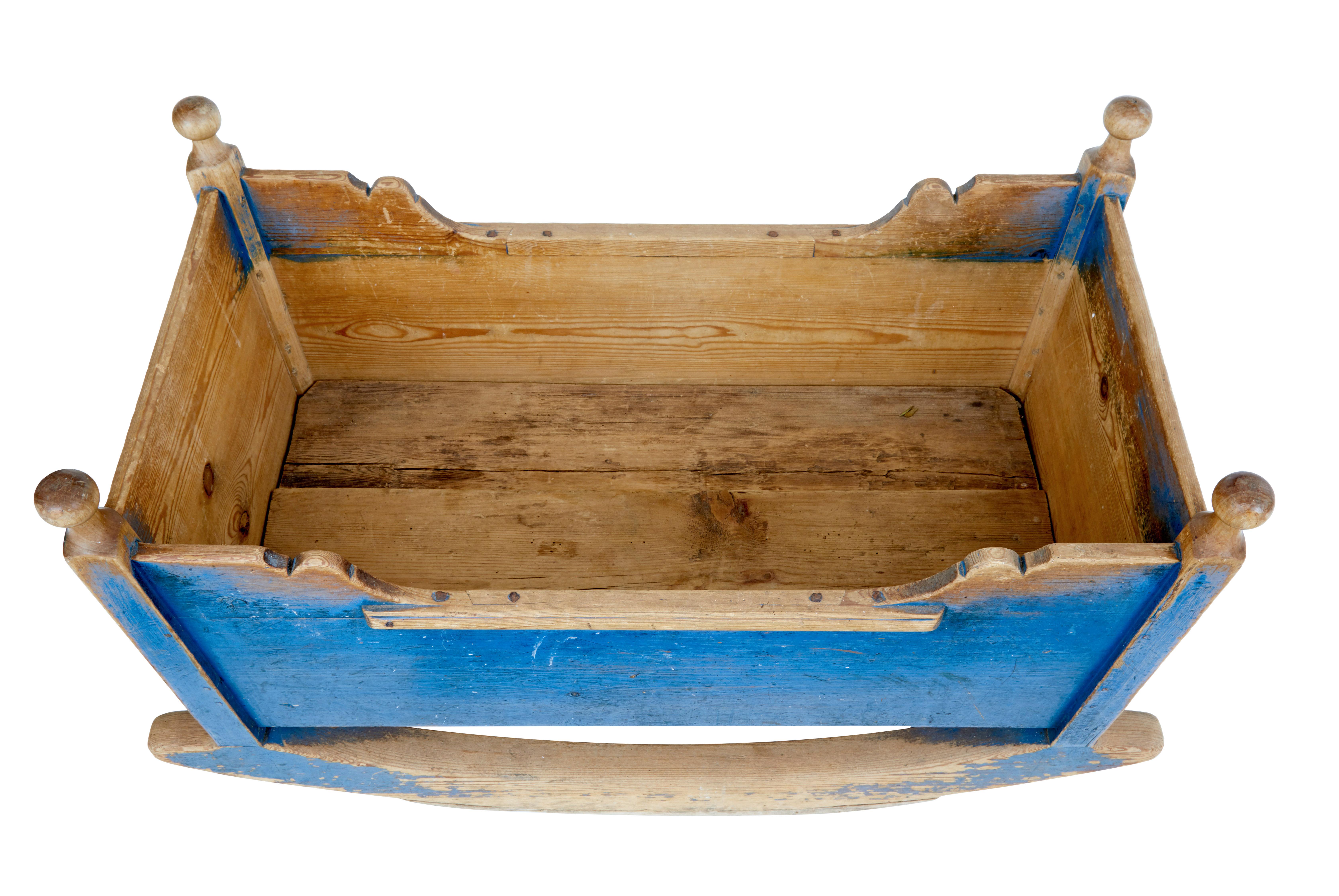 Original condition traditional Swedish rocking cradle, circa 1850.

Painted in traditional blue colours with personalised inscribed with 2 births with initials from 1852 and 1855. Rare piece painted in original colours, turned finials in