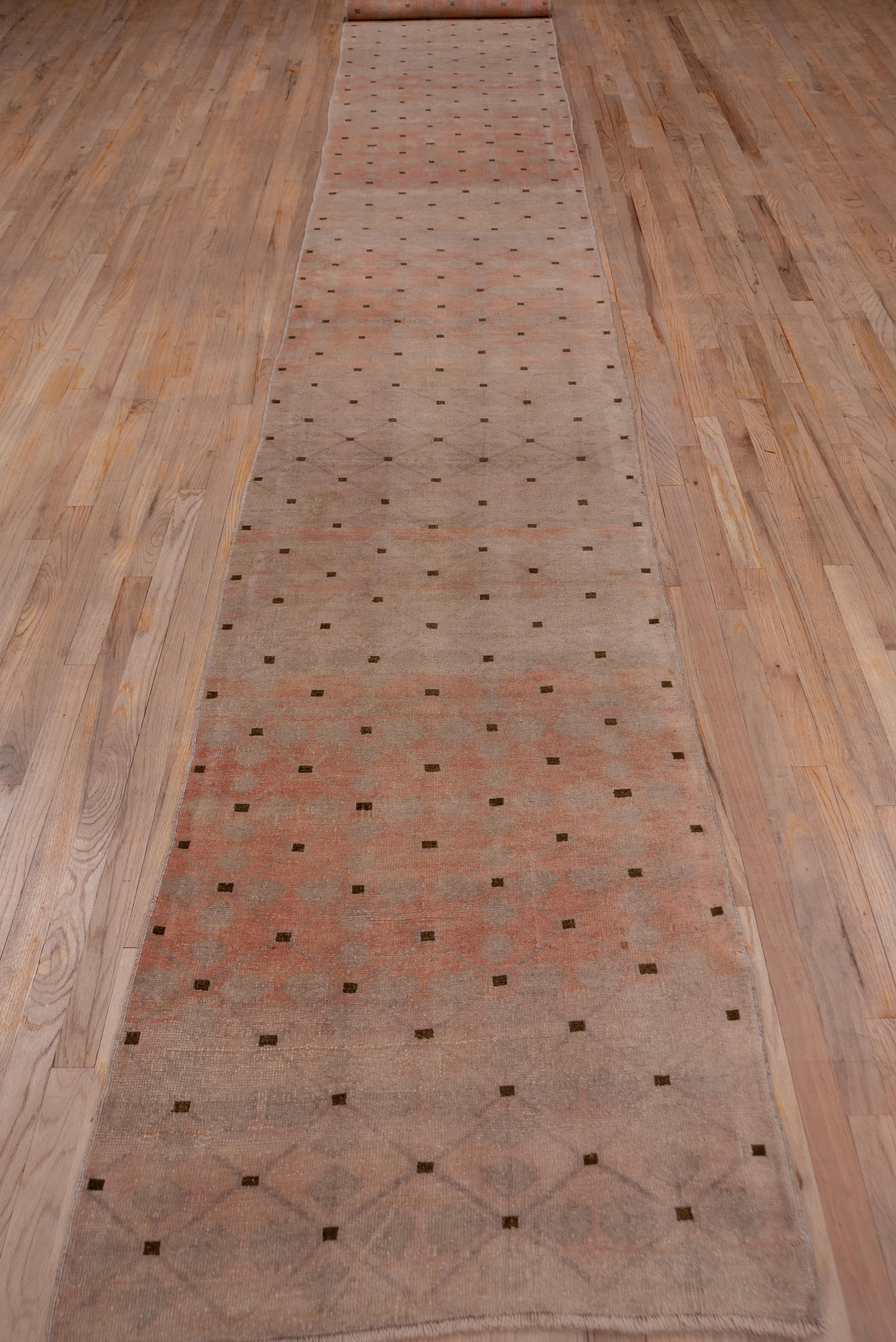 This borderless runner shows an allover diamond lattice with brown squares at the vertices on an oatmeal ground. The condition is good and the lattice is subtle, giving a very modern look to the piece. Also very contemporary.