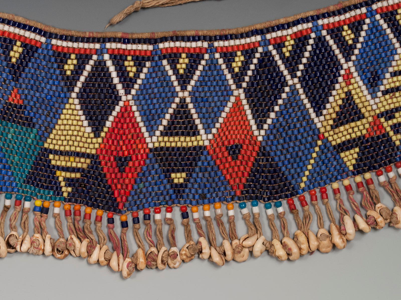 Mid-20th century tribal beaded cache-sexe modesty apron (pikuran), Mandara Mountains, Cameroon

These colorful cache-sexe were worn for celebrations, rituals and rites of passage by women who had reached puberty. A very colorful, jazzy example