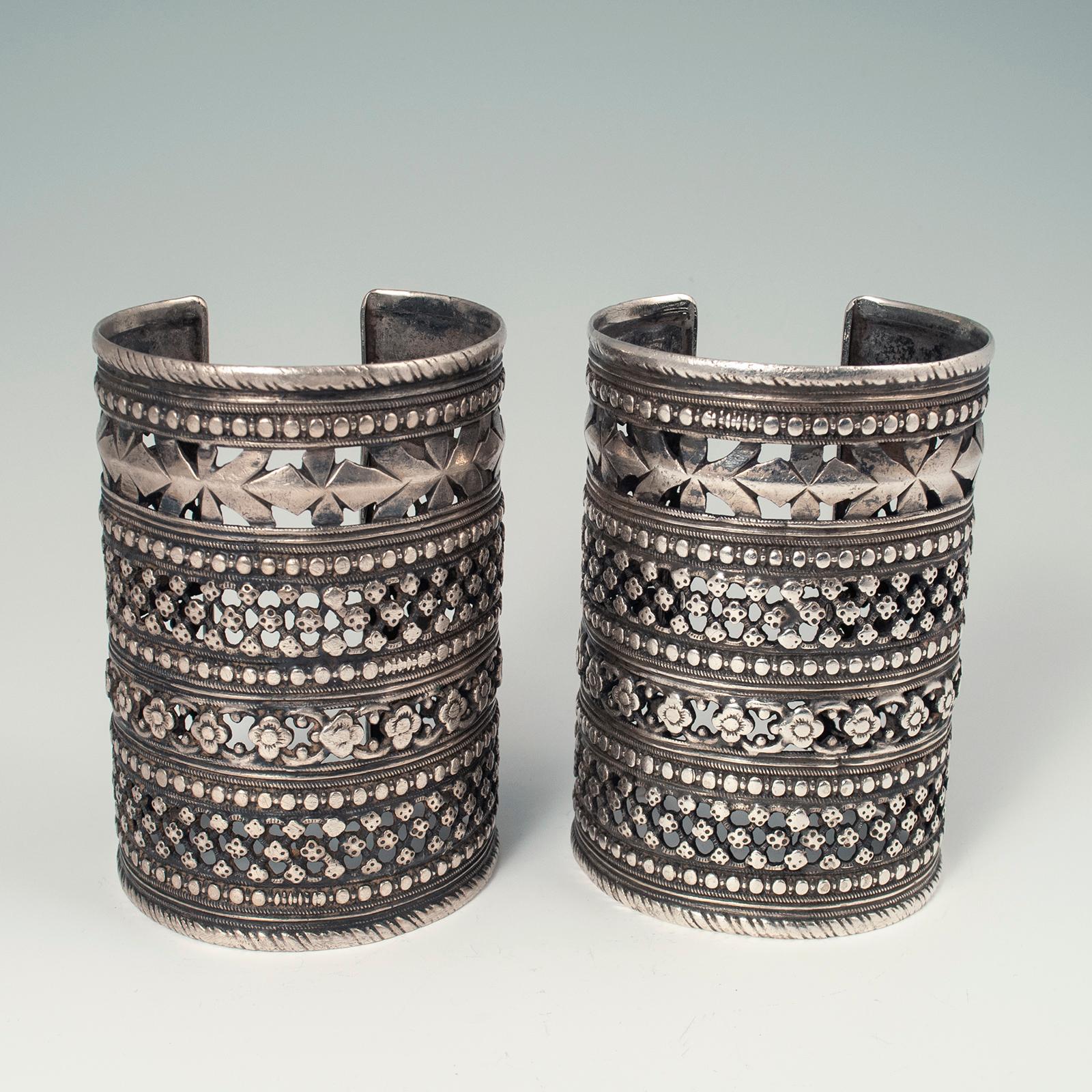 Mid-20th century silver tribal cuffs, Hazara tribe, Afghanistan

A pair of intricate cut-work silver cuffs worn by women of the Hazara tribe in Afghanistan. Very good workmanship and condition. Weight is 200 grams each. 8.25 inch interior