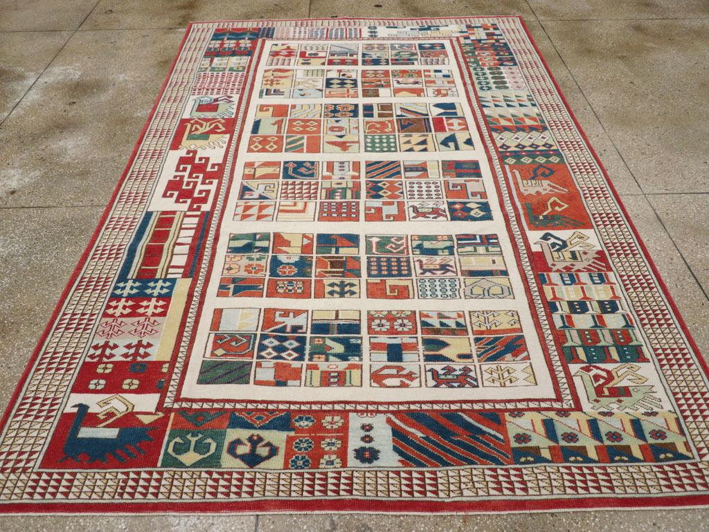 A vintage Turkish Anatolian accent rug handmade during the Mid-20th century.

Measures: 6' 9