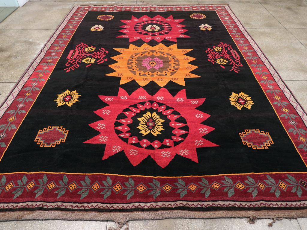 A vintage Turkish Anatolian large tribal room size carpet handmade during the Mid-20th century.

Measures: 11' 8