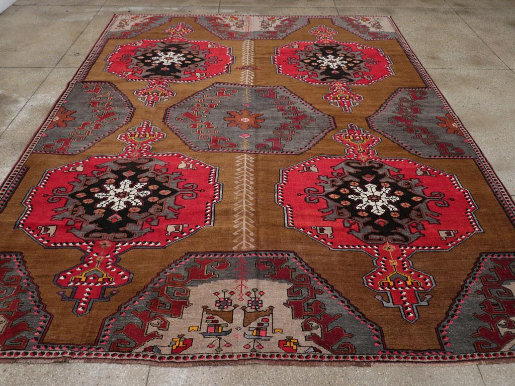 A wool pile of symmetric knots on a wool foundation. This striking rustic carpet shows a rust-red field with a decoration of full and partial octagons in green and crimson, with red and green centers respectively. The red medallions have ragged