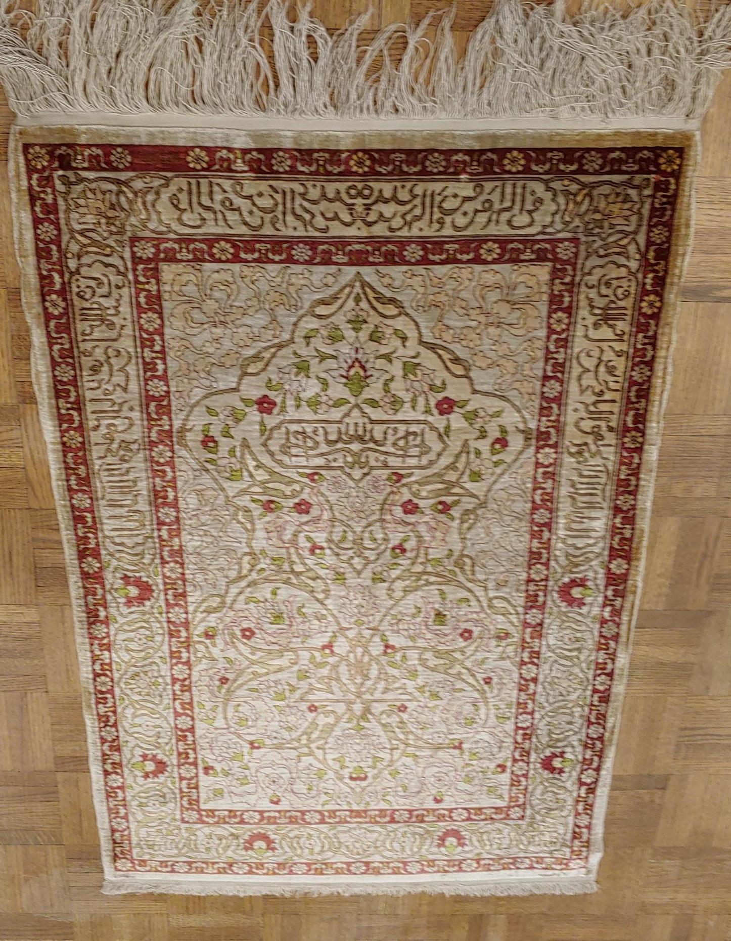 This is a spectacular example of a signed silk Turkish Hereke with around 800 knots per square inch. The design is an all-over floral motif on an ivory field. The pile is silk and the warp and weft are also silk. It is also decorated with metallic