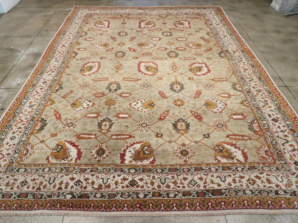 A vintage Turkish Oushak large carpet handmade during the Mid-20th century.

Measures: 12' 9