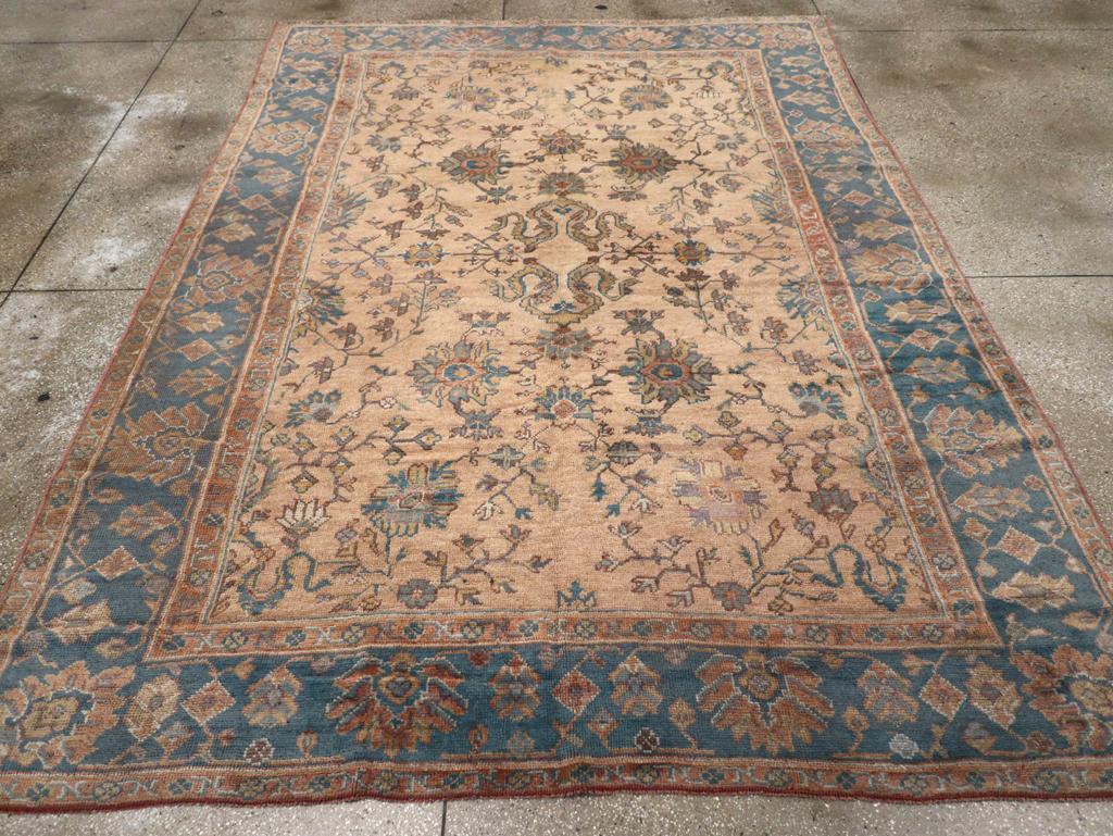 A vintage Turkish Oushak Room Size carpet handmade during the Mid-20th century.

Measures: 8' 3