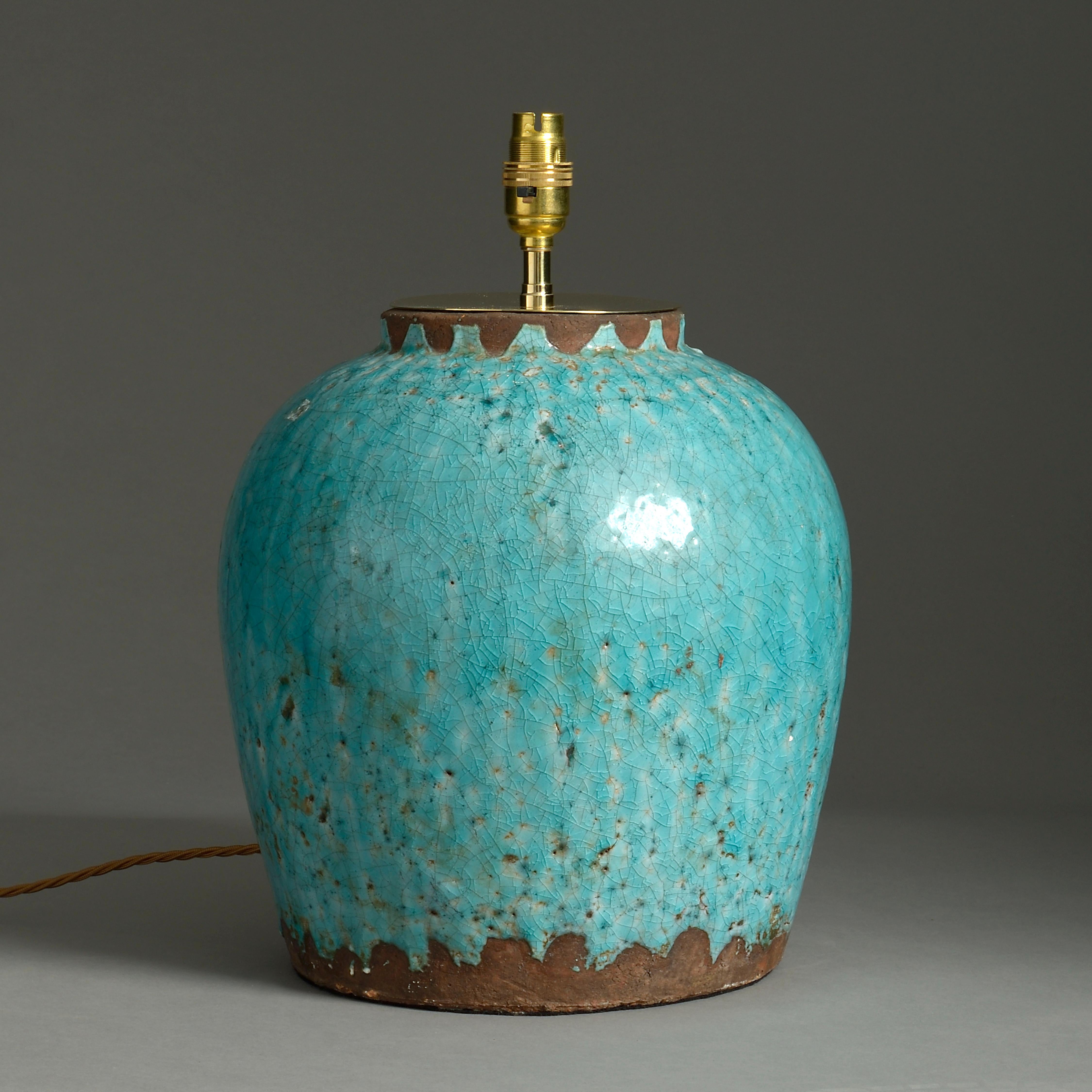 A generously modeled mid-20th century studio pottery vase with deep turquoise crackle glaze, now mounted as a table lamp.

Dimensions listed refer to ceramic parts.

This lamp is currently wired for UK lighting. It can be adapted for US, EU or