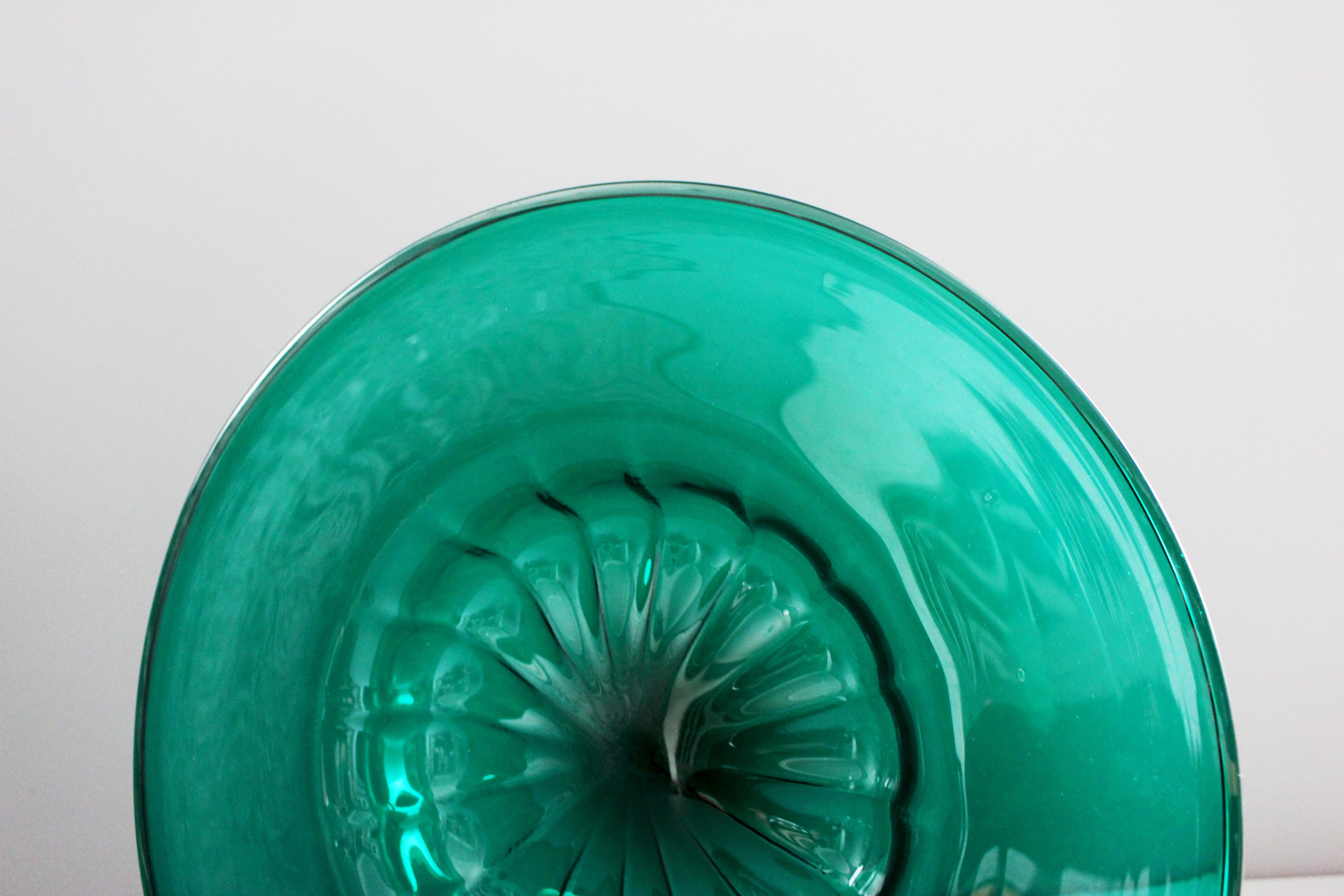 A Mid-Century Murano glass platter by Venini, circa 1960, emerald green, circular form with central well and broad rim, underneath acid etched Venini Murano Italia.