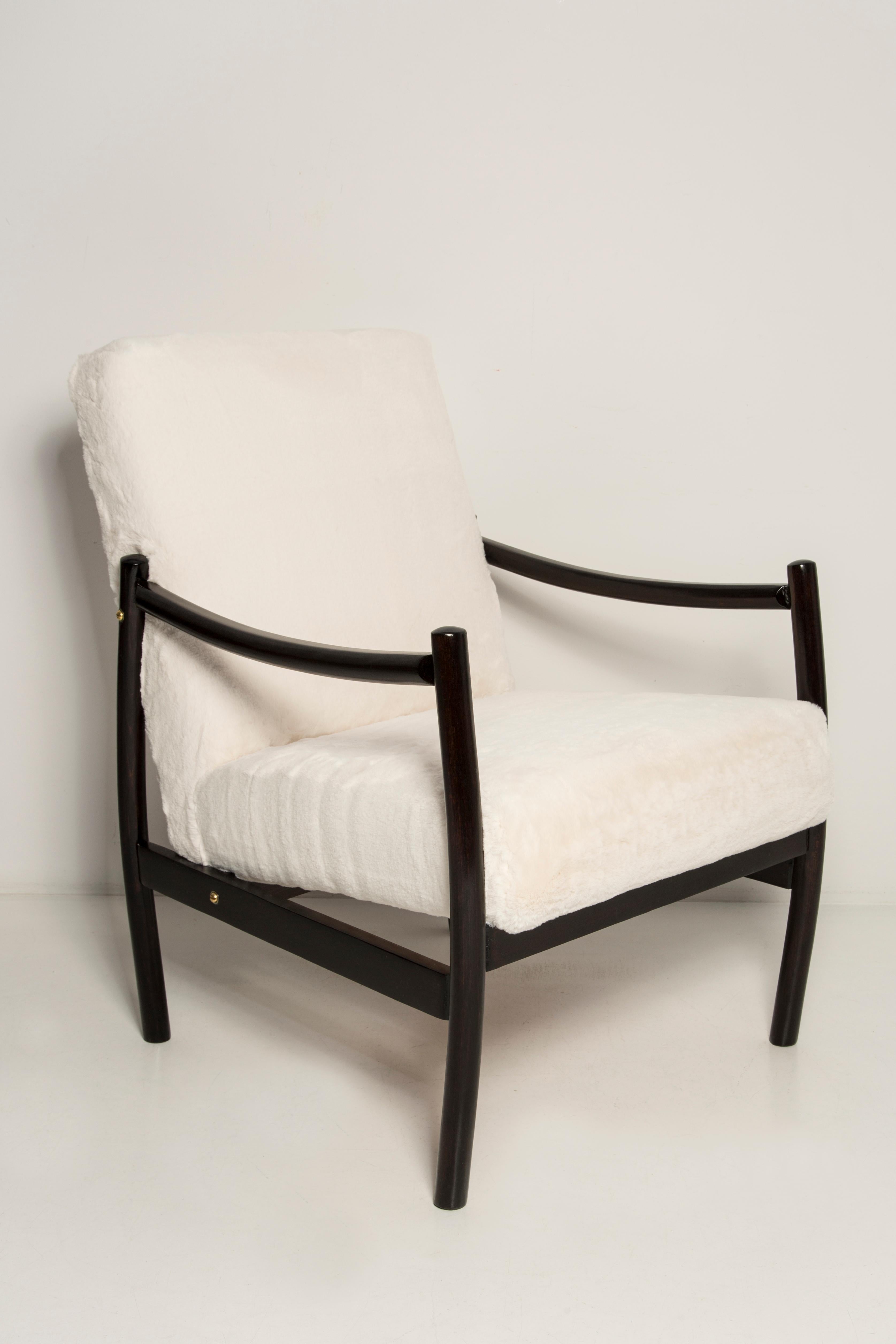 Armchair produced in the 1960s by Radom Furniture Factories. Very comfortable seat covered with high quality fabric. The armchairs are fully carpentry and upholstery. Extremely comfortable model. We can prepare also another color versions of