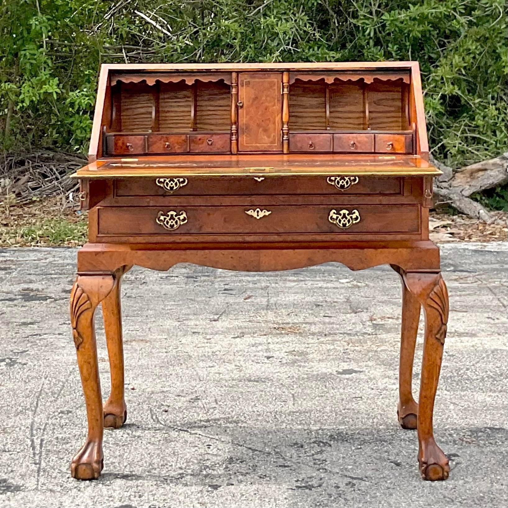 A fantastic vintage Boho writing desk. A gorgeous Burl wood flip down design. Beautiful hand carved detail and cabriolet legs. Lots of great storage inside. Acquired from a Palm Beach estate.