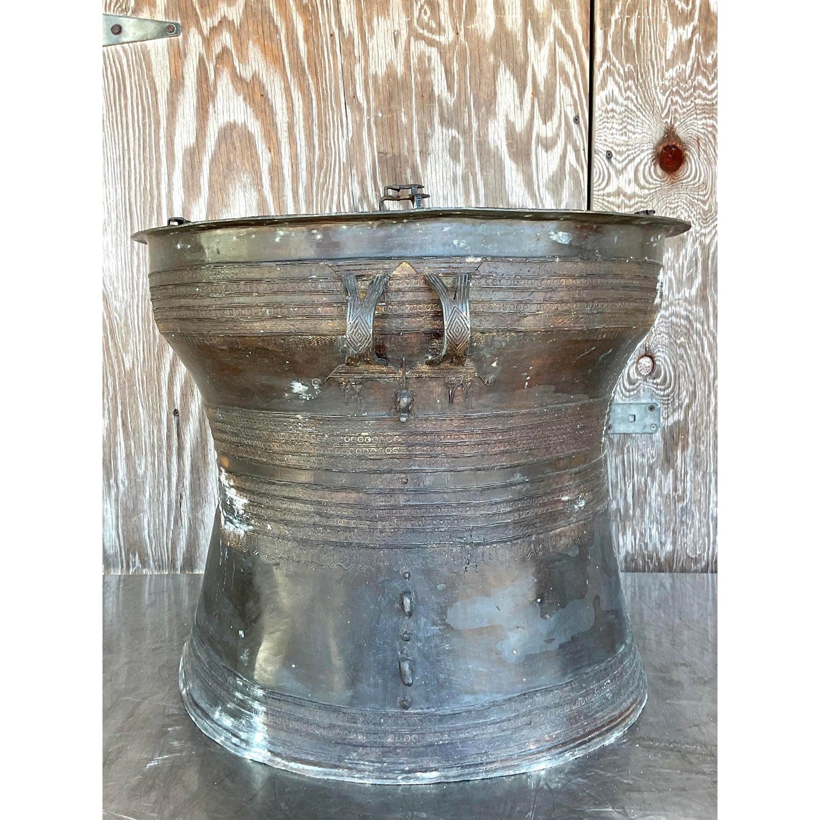 A stunning vintage Boho rain drum a chic patinated bronze frame with highly detail metal work. An incredible all over patinated finish from time and age. Acquired from a Palm Beach estate.

The rain drum is in great vintage condition. Scuffs and