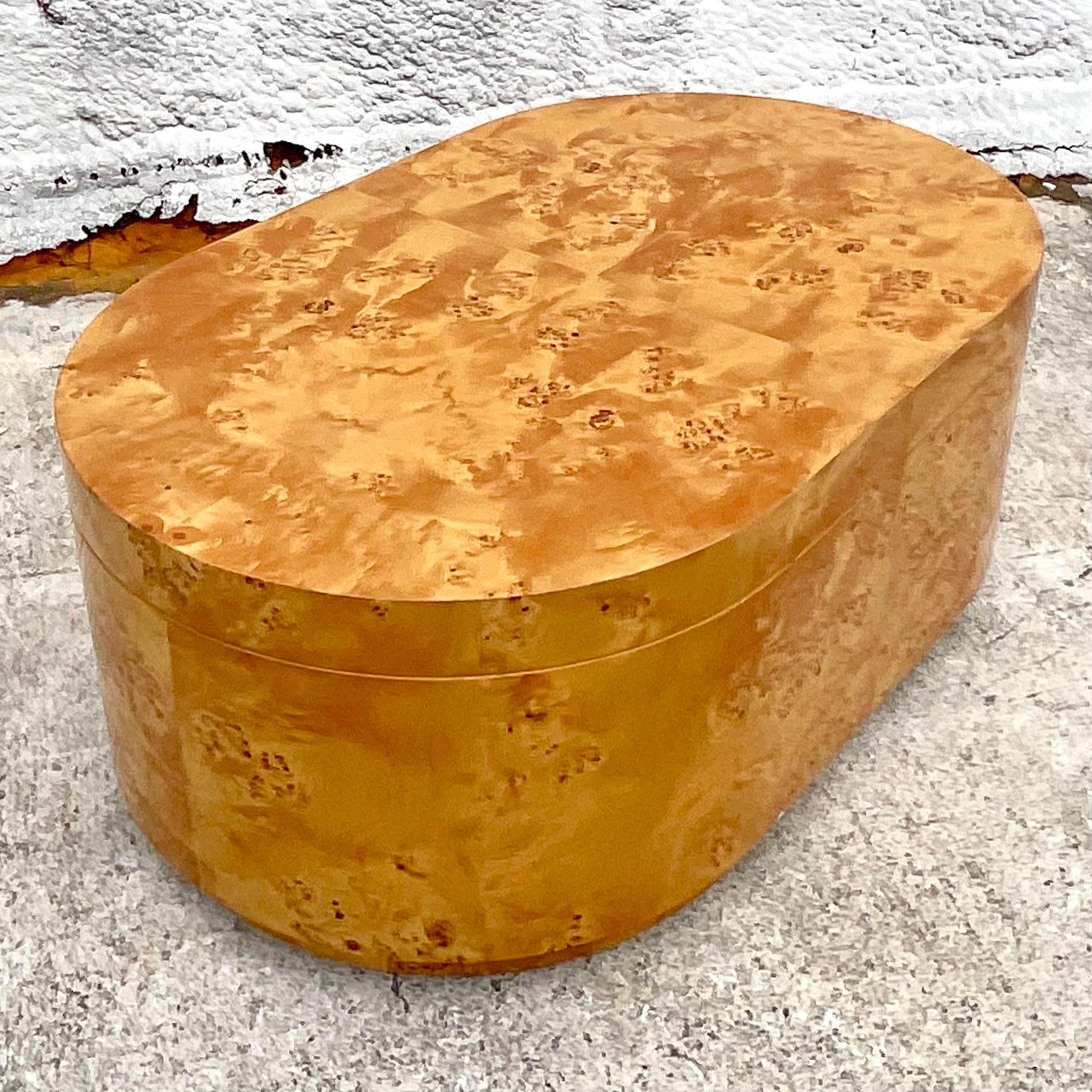 Elevate your living room with this Vintage Boho Custom Burl Wood Storage Coffee Table. Featuring rich burl wood and intricate craftsmanship, it combines bohemian elegance with practical American design. The hidden storage compartment adds