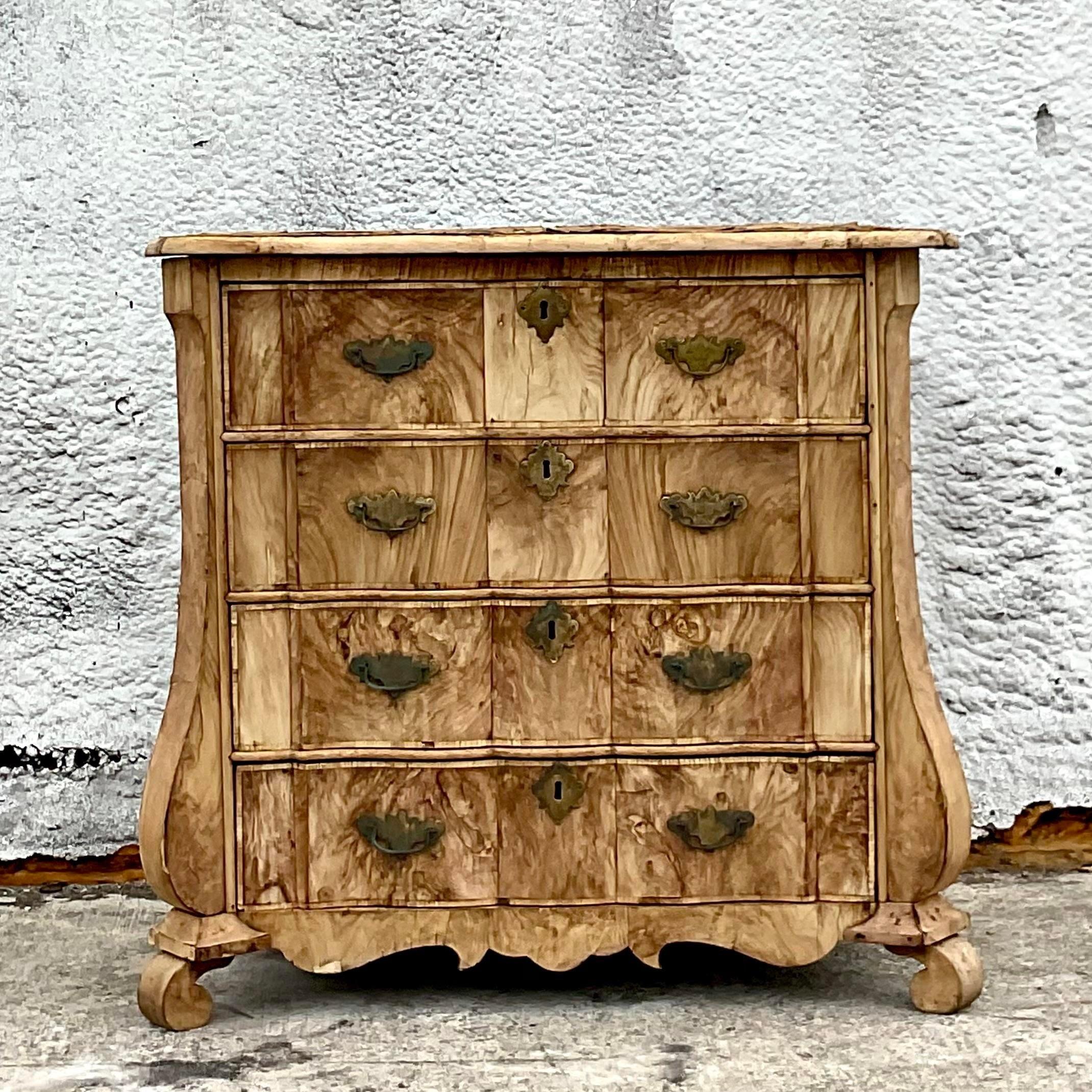 A fabulous vintage distressed chest of drawers. A gorgeous bleached Burl wood in a classic Bombe shape. An all over patina from time. This piece is extraordinary, but it’s a look for sure. You must like this look. Acquired from a Palm Beach estate