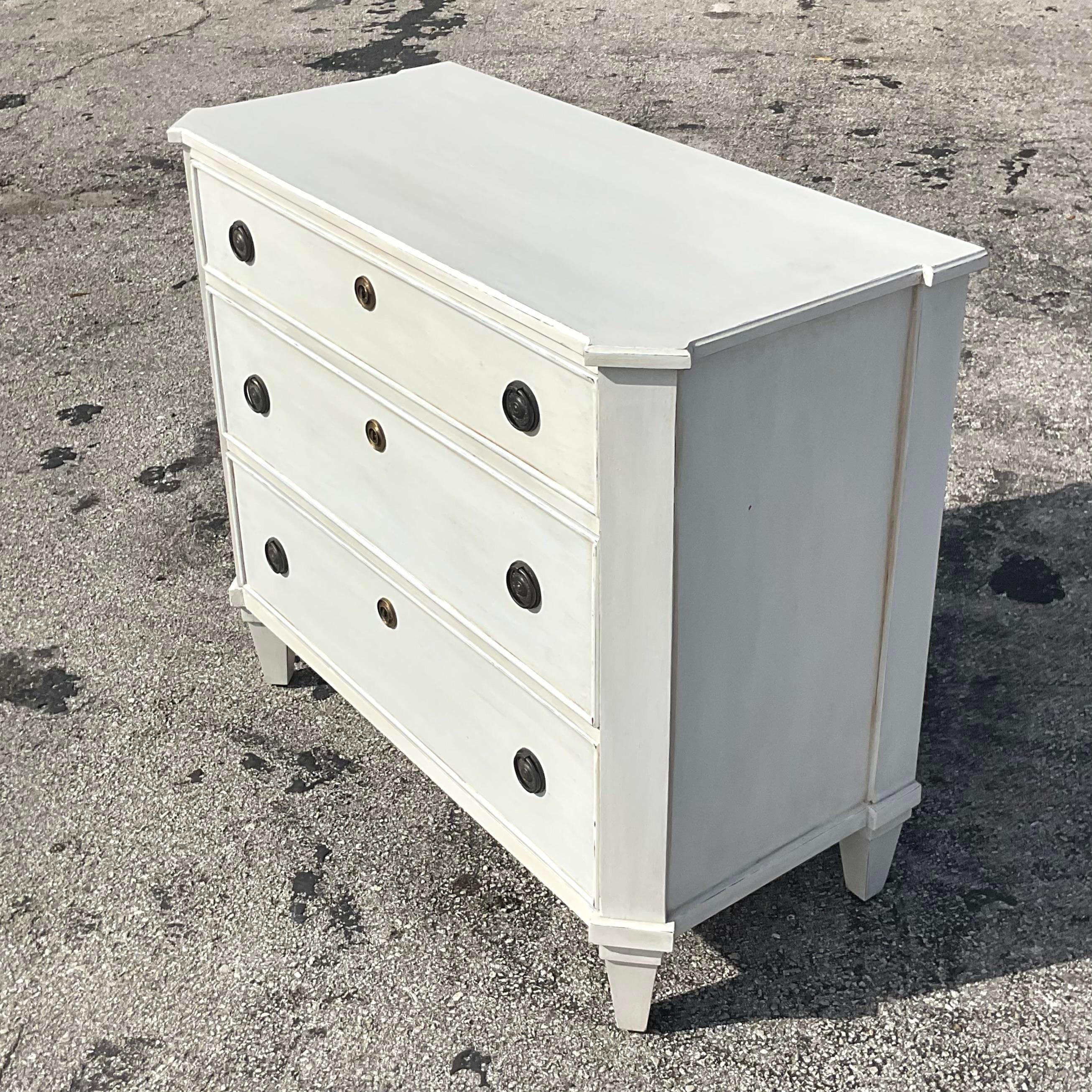 A stunning vintage Boho chest of drawers. A chic Gustavian style cabinet in an off white washed finish. Acquired from the collection of the iconic Designer Lars Bolander.