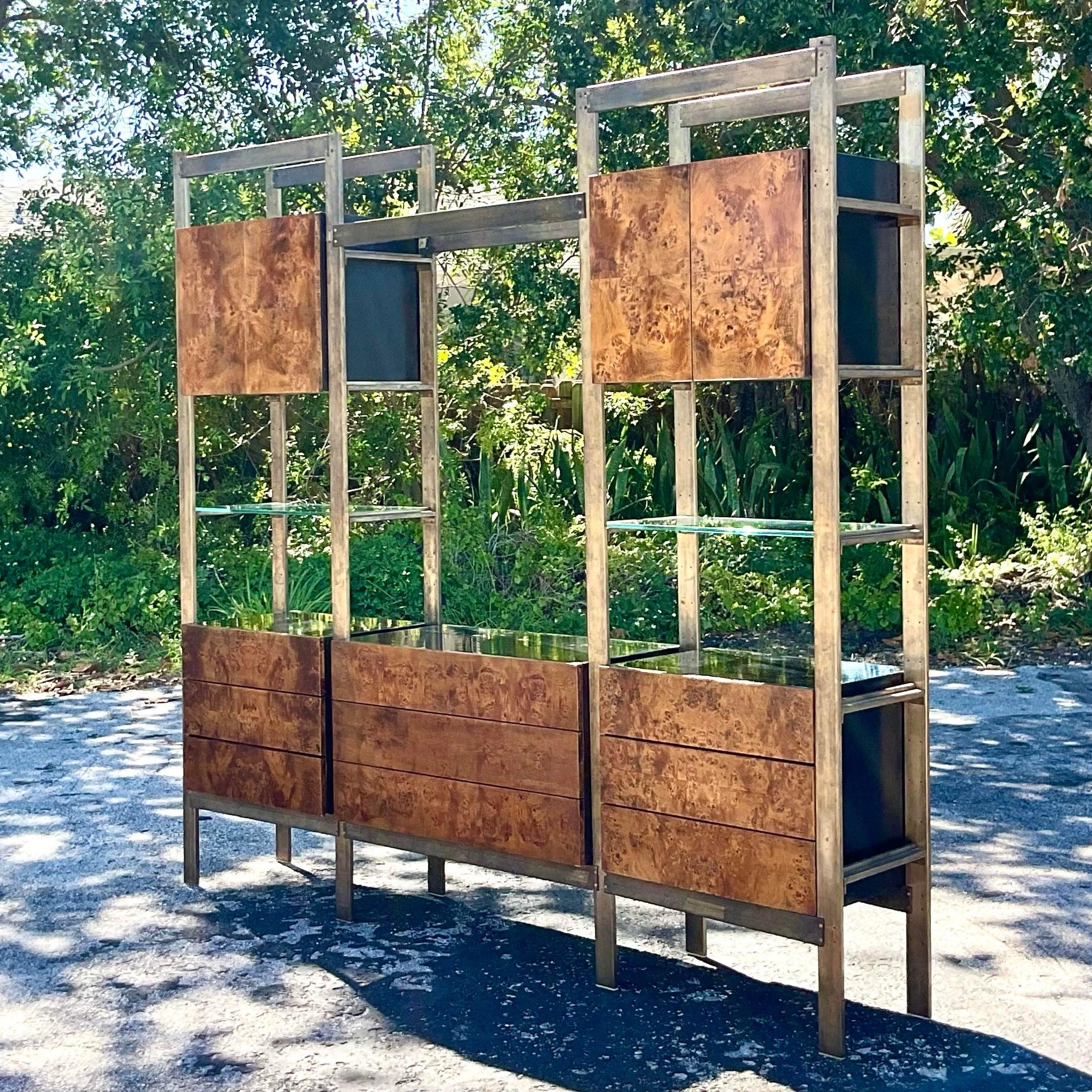 Add a dash of American charm to your space with this exquisite Vintage Boho John Stuart Burl Wood and Brass Etagere. Crafted with meticulous attention to detail, this piece combines the warmth of burl wood with the sophistication of brass accents,