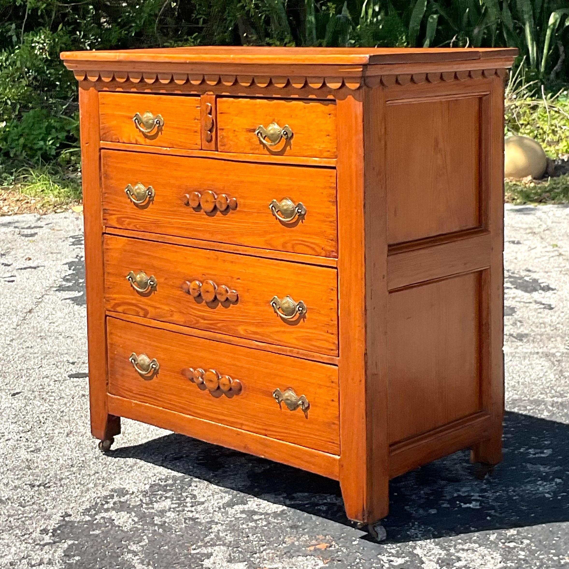 Embrace eclectic charm with this Vintage Boho Scalloped Chest and Drawers, reflecting the free-spirited essence of American bohemian style. Its scalloped design exudes whimsical elegance, while the meticulous craftsmanship adds a touch of timeless