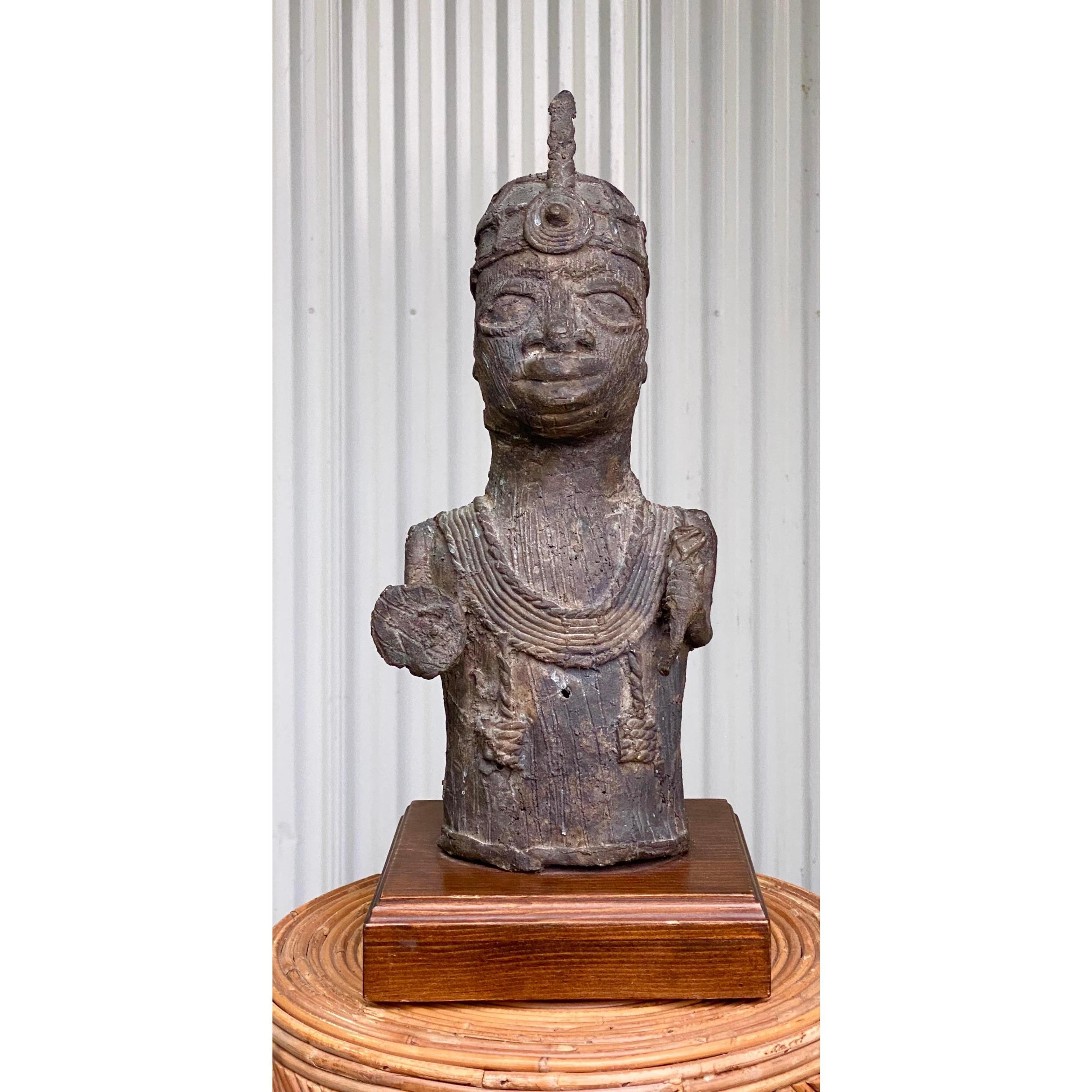 Chic bronze Brutalist tribal sculpture. A depiction of a tribal king. Rough hewn and signs of the hand work. Acquired from a Palm Beach estate