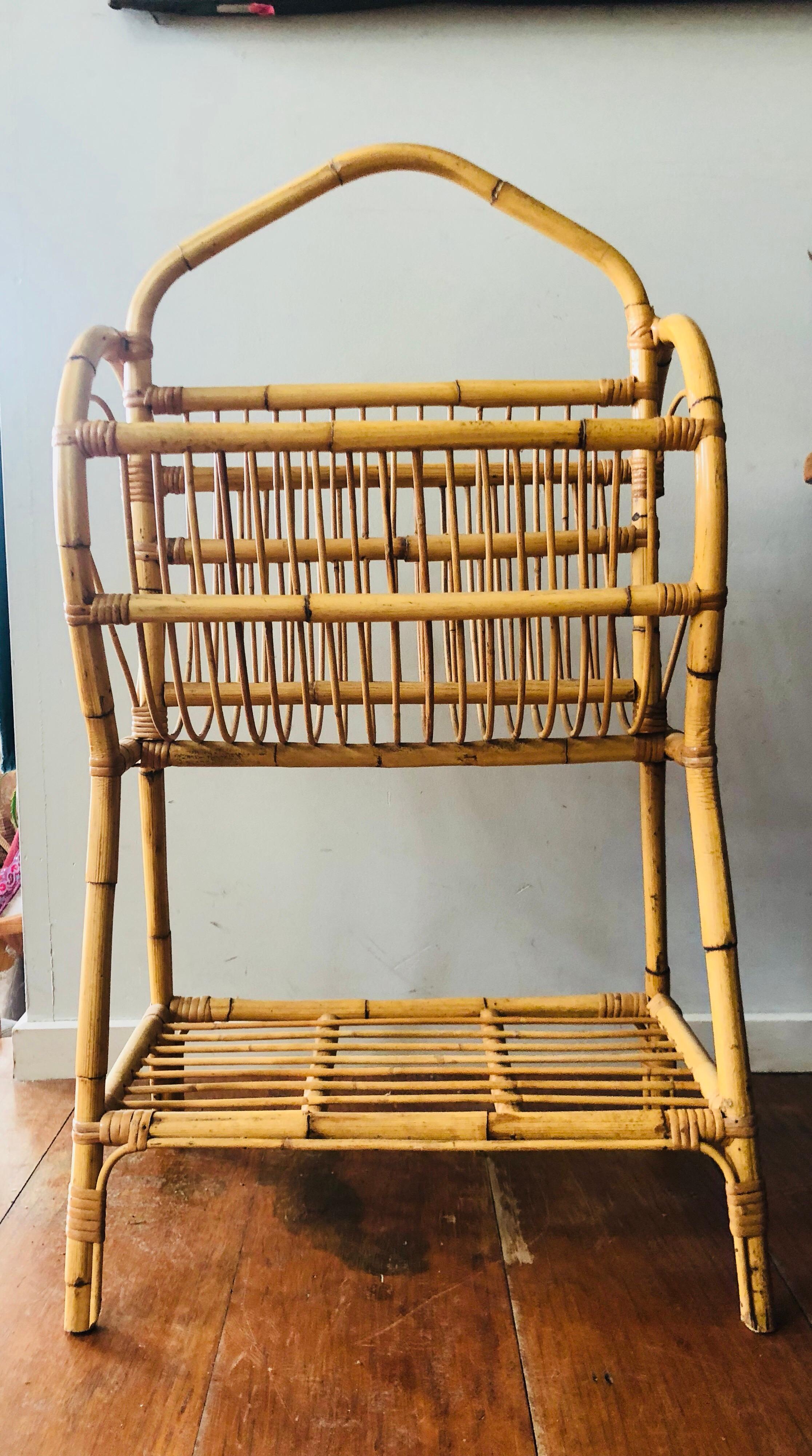 Mid-20th century cane unusual tall magazine rack
Heart shaped ends and flat storage rack to base
Nice color and definition.