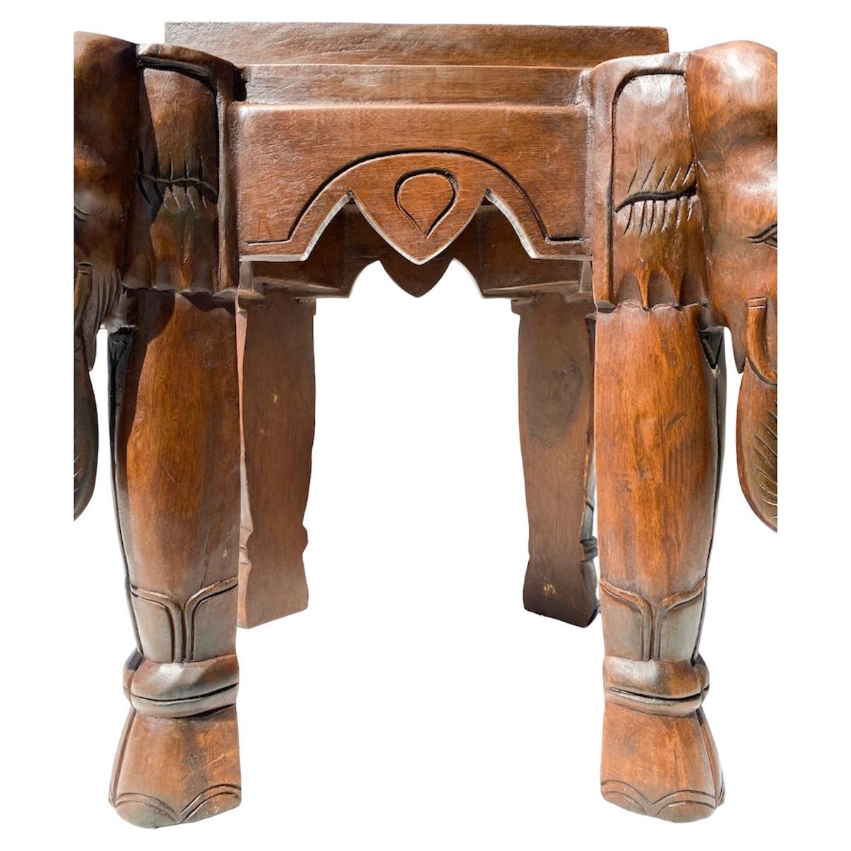 Carved Elephant side table , possible a foot stool or plants stand. This is solid and beautiful.