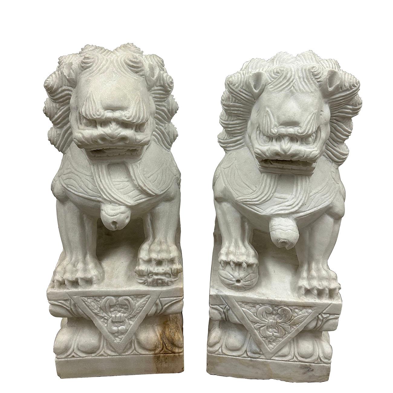 A pair of magnificent Chinese Stone Lion Statuary. They are hand carved from marble stone. According to historical books, lions were introduced into Mainland China firstly as tributes to the Emperors. They are symbols of justice in bureaucratic