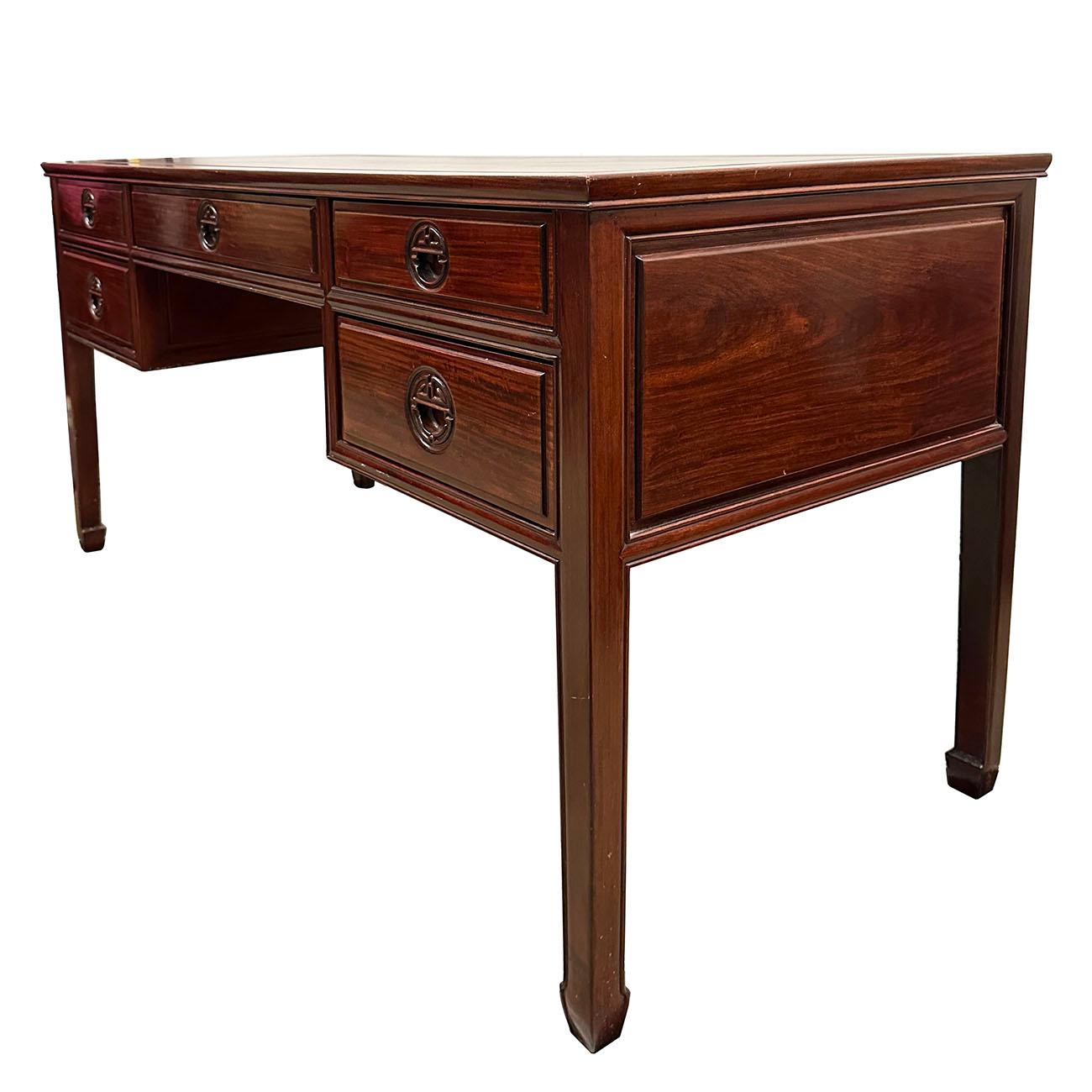 This unique writing desk has two drawers each side and one bigger drawer at center of the front and both sides and back are nicely finished. This desk was made at about 1950's from solid rosewood with dark finished and has some traditional Chinese