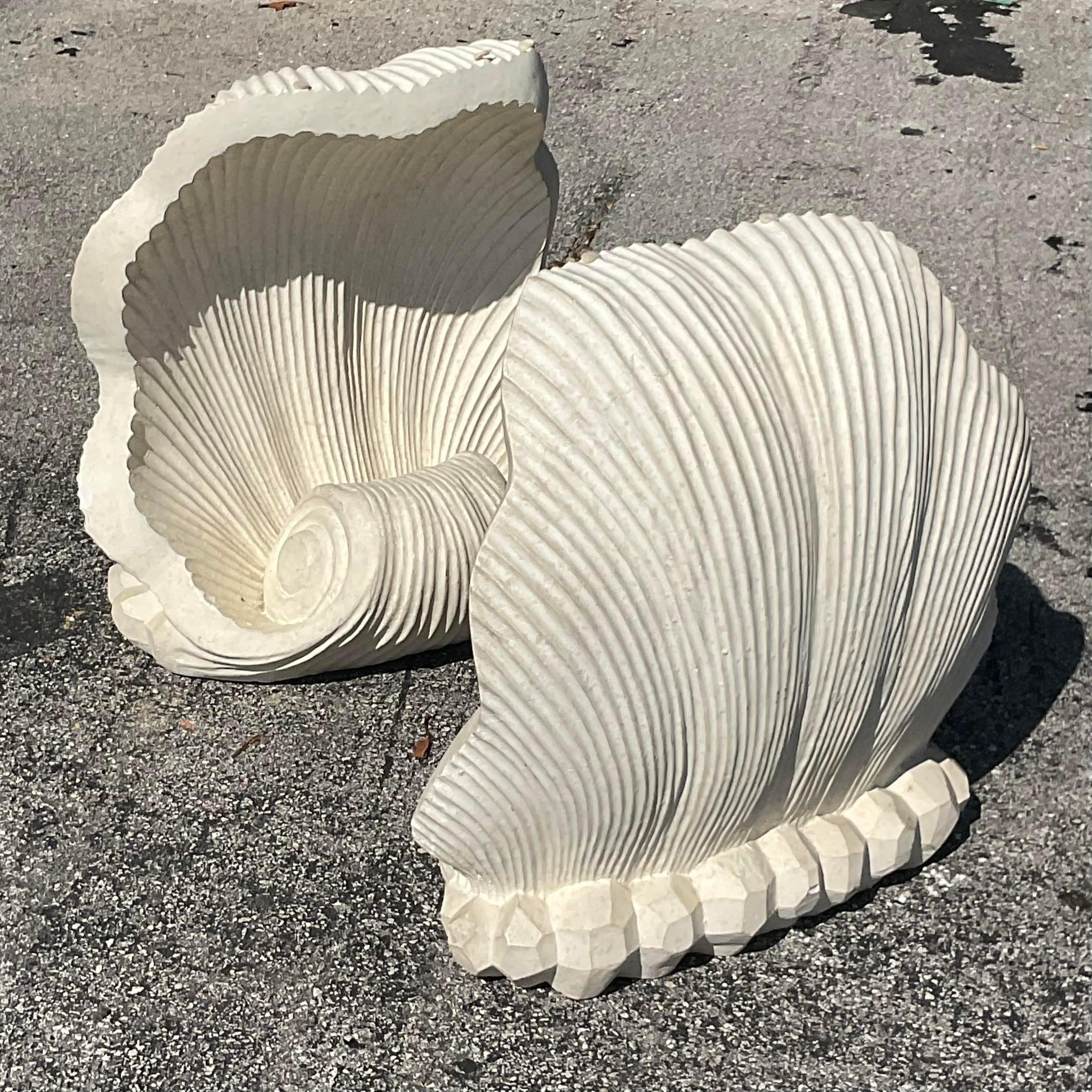 Add a touch of coastal charm to your space with this set of 2 Vintage Cast Concrete Clam Shell Table Pedestals. Their unique design captures the essence of American seaside elegance, making them the perfect statement pieces for any home or garden