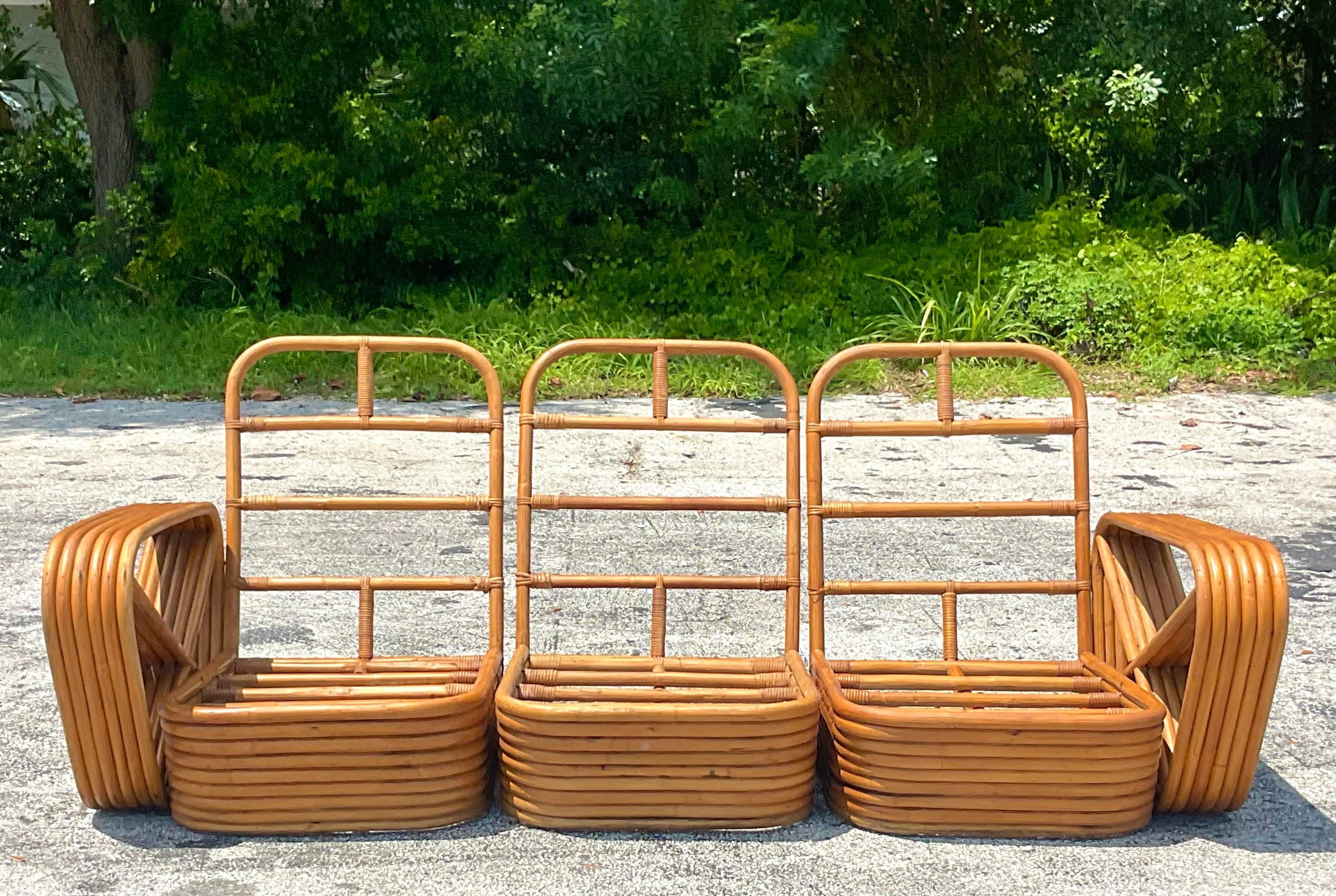 A fantastic vintage Coastal sofa. The iconic 6 strand bent rattan shape with three sections. In excellent condition. Acquired from a Palm Beach estate. 