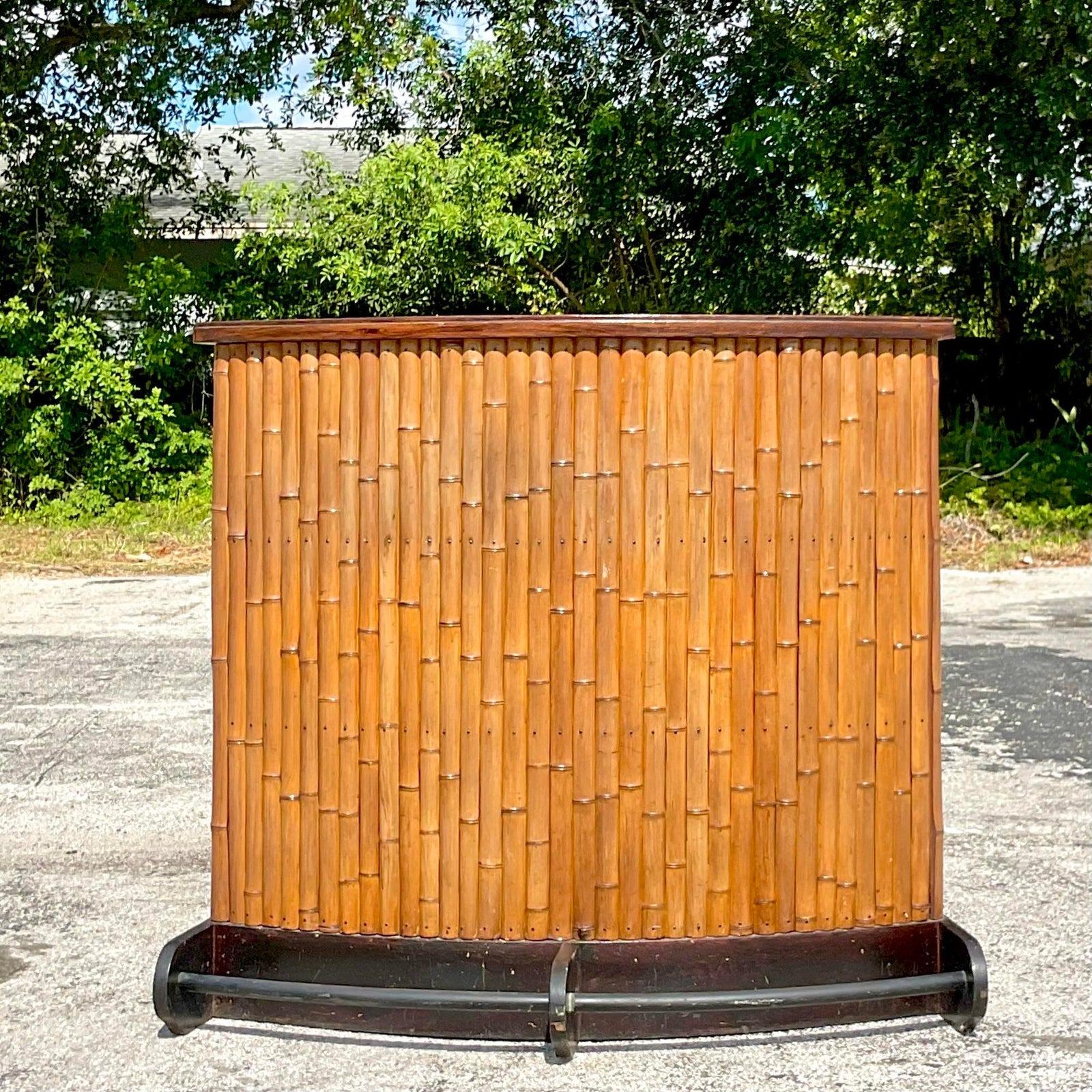 A fabulous vintage Coastal tiki bar. A real Midcentury gem with lots of great storage behind. Black laminate top for extra efficiency. Acquired from a Palm Beach estate.