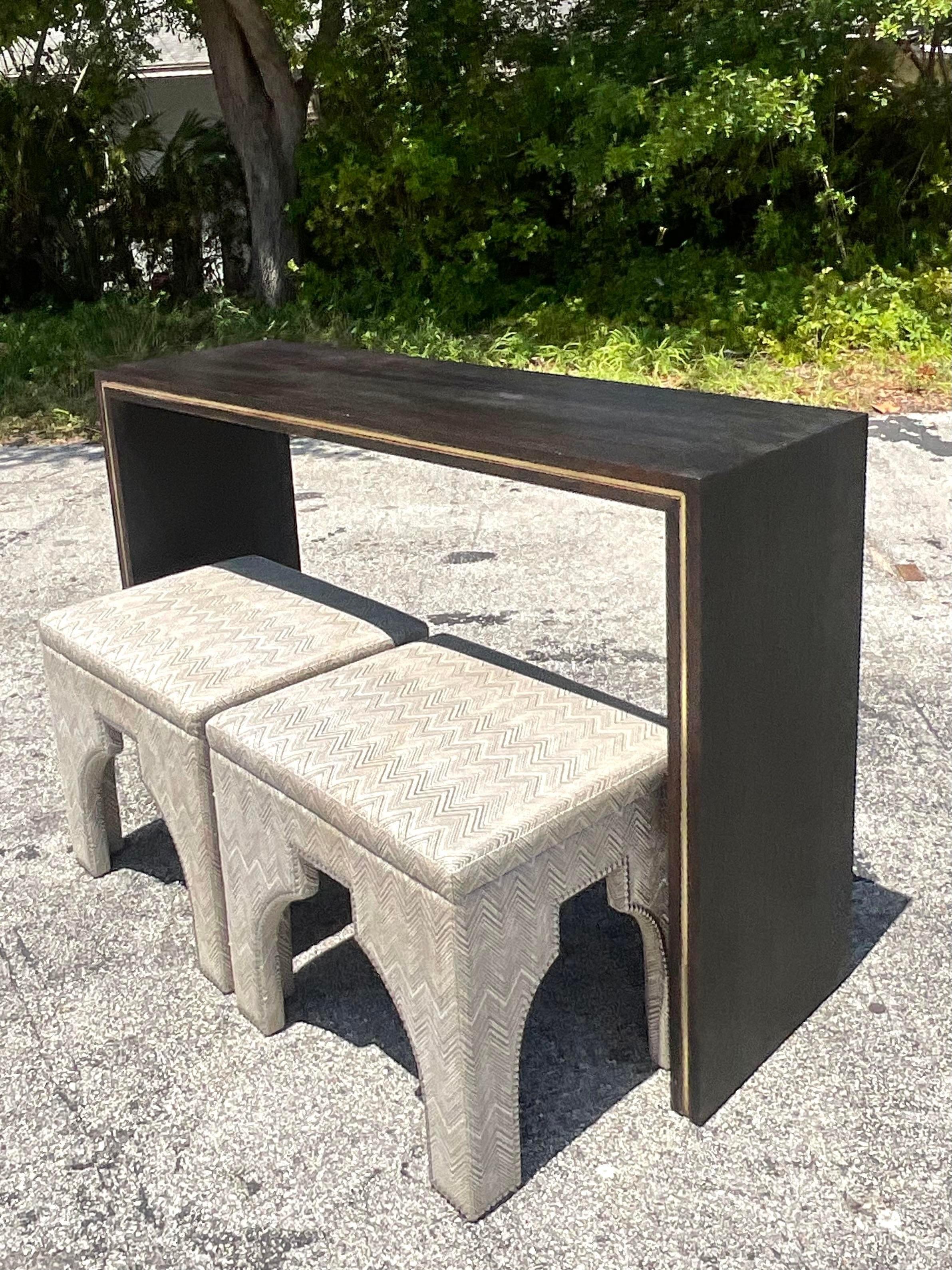 Make a bold statement with this vintage contemporary monumental custom brass inlay console table. Crafted with American craftsmanship and modern flair, its exquisite brass accents add a touch of sophistication to any space, while its timeless design
